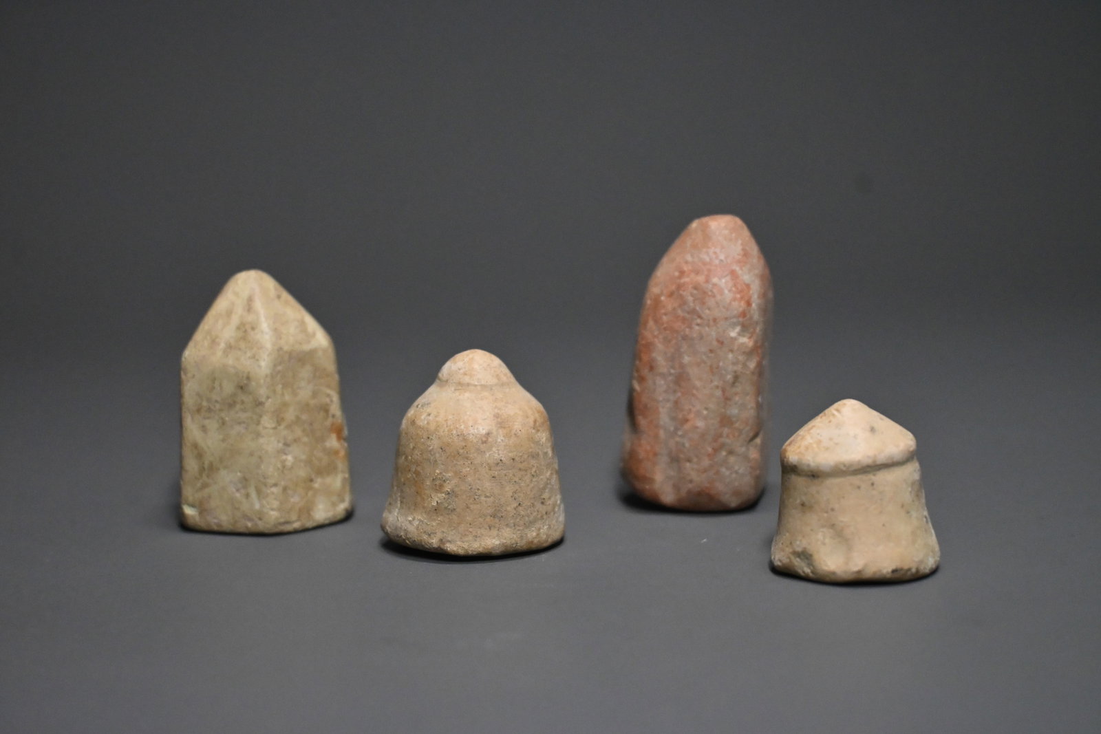 Group of 4 Islamic Nishapur terracotta gaming pieces (1 of 3)