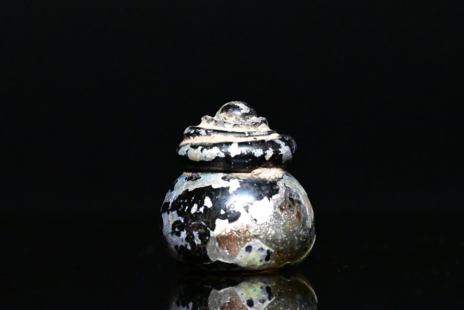 A glass chess or gaming piece (1 of 5)