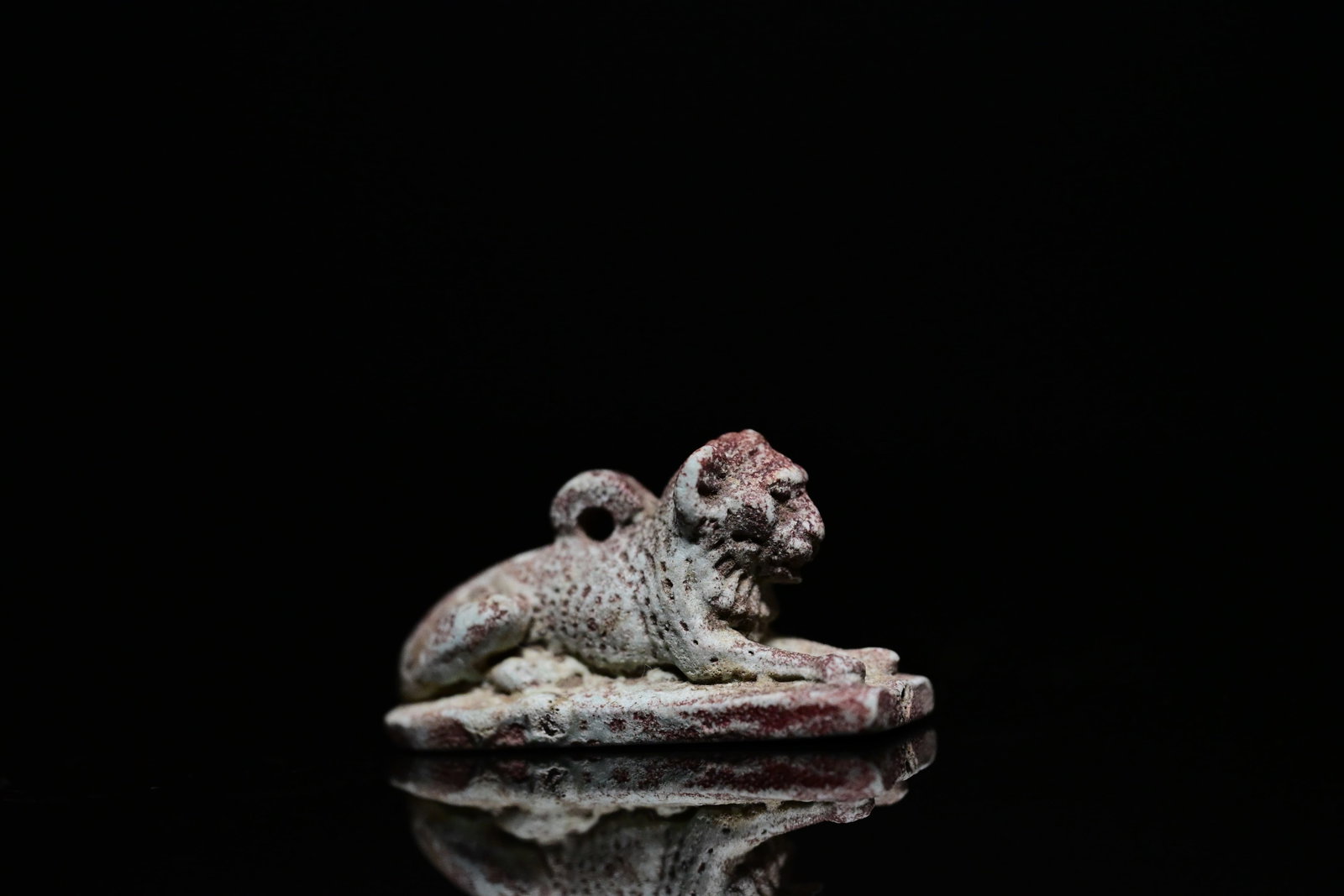 An egyptian faience amulet of crouching lion (1 of 7)