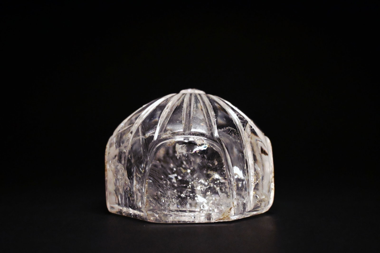 A large fatimid rock crystal chess or game piece: Fatimid Rock Crystal Gaming Piece / WeightEgypt or Syria, Fatimid Period, 10th–12th Century AD5.5cm height x 6.8cm diameter