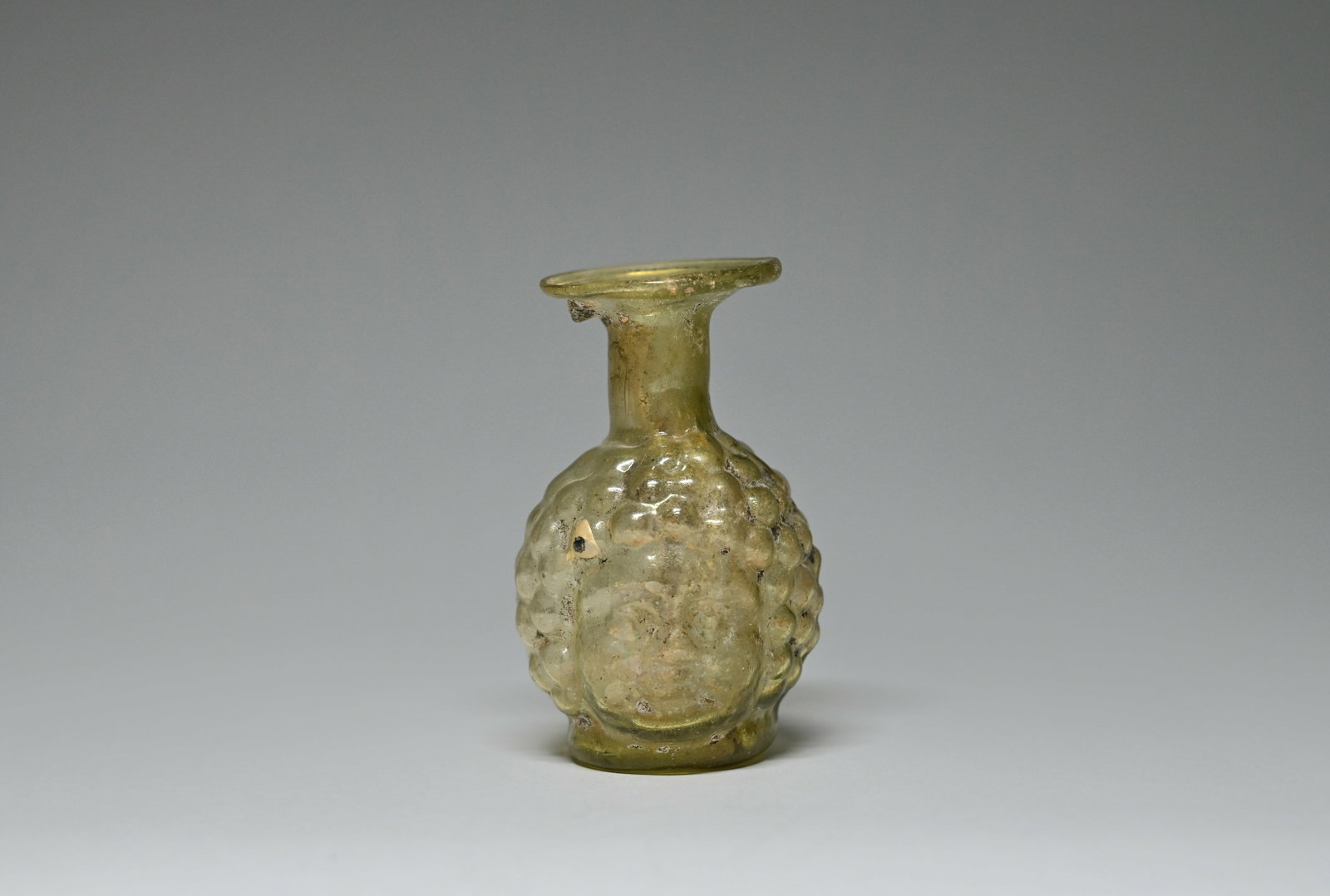 A Roman olive-green glass double-headed flask (1 of 7)