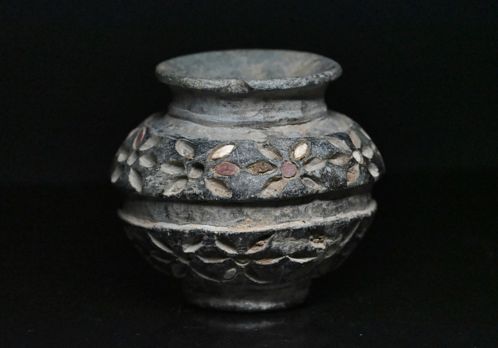 A bactrian chlorite stone vessel: Ancient Central Asia, Bactrian/jiroft vase with vegetal motifs ca. 2500 to 2250 BCE. Size: 7.5cm H