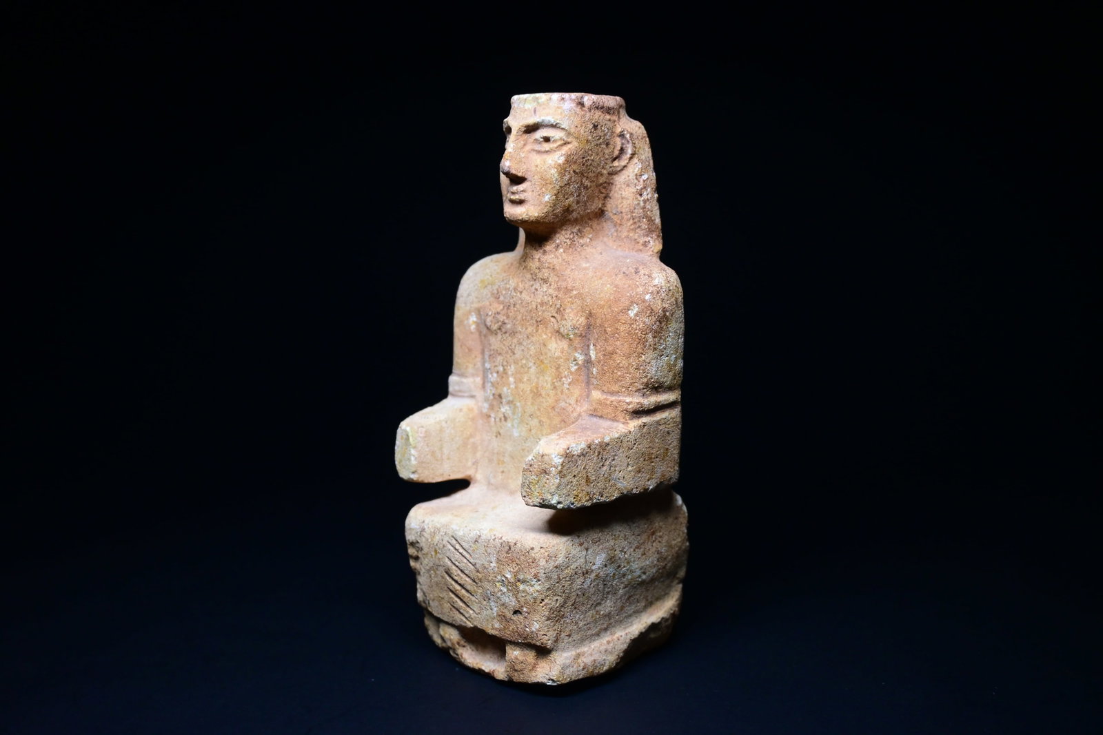 A south arabian seated female statuette: South Arabian Limestone Seated Female Statuette 3rd-2nd century B.C.Size:16cm HProvenance: property of an european collector, acquired in early 1980s