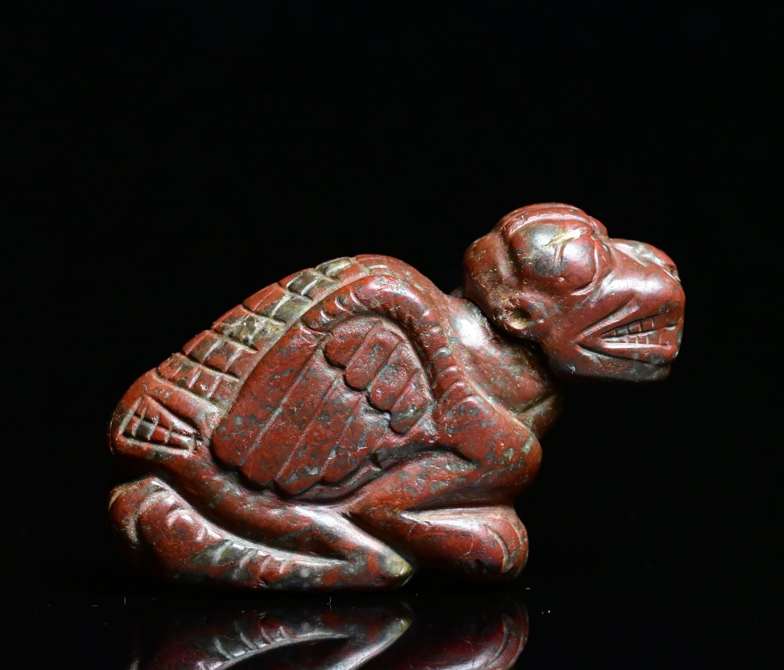 Neo-Assyrian jasper amulet figure of crouching pazuzu: Jasper amulet crouching Pazuzu FigureNeo-Assyrian, circa 8th–7th Century BCE.A finely carved jasper figure depicting the demon Pazuzu in a crouching posture. The figure displays an expressive head