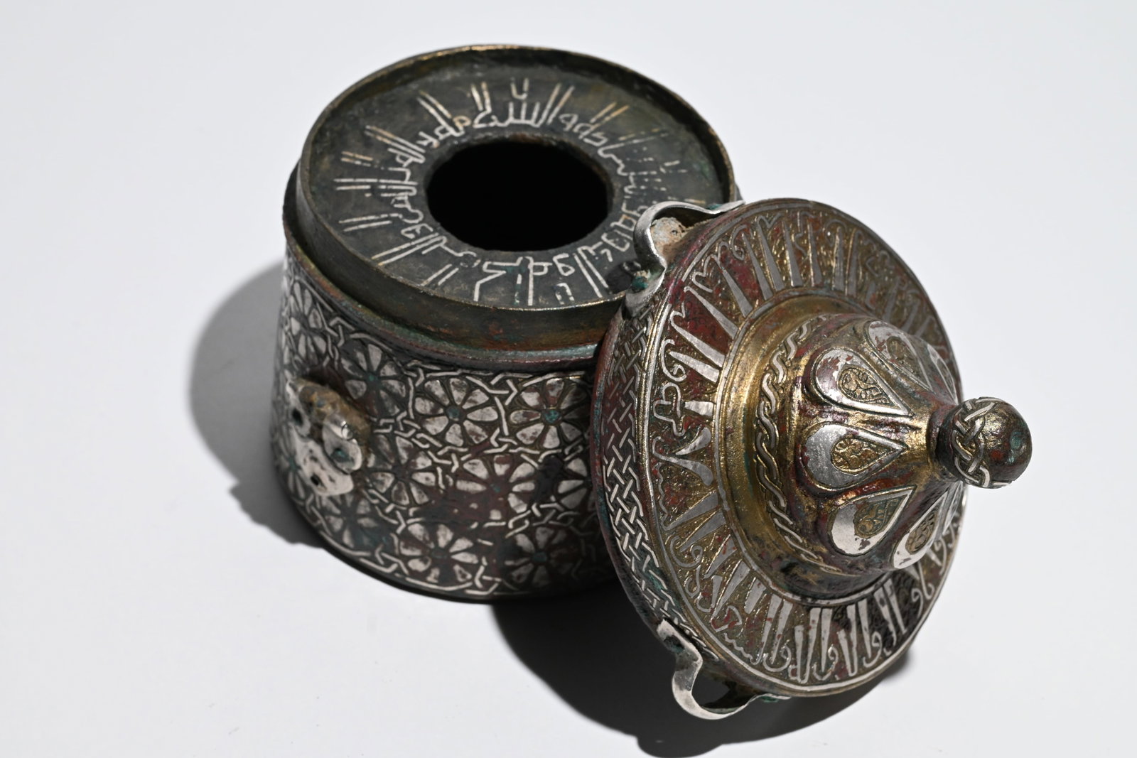 An exceptional Khurasan silver-inlaid bronze inkwell. (1 of 10)