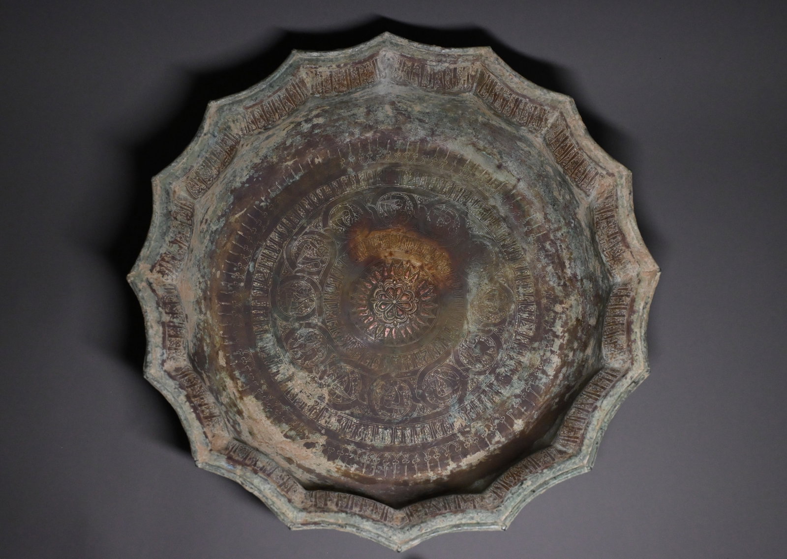 A large Seljuk copper-inlaid bronze 'Lagan' basin. (1 of 8)