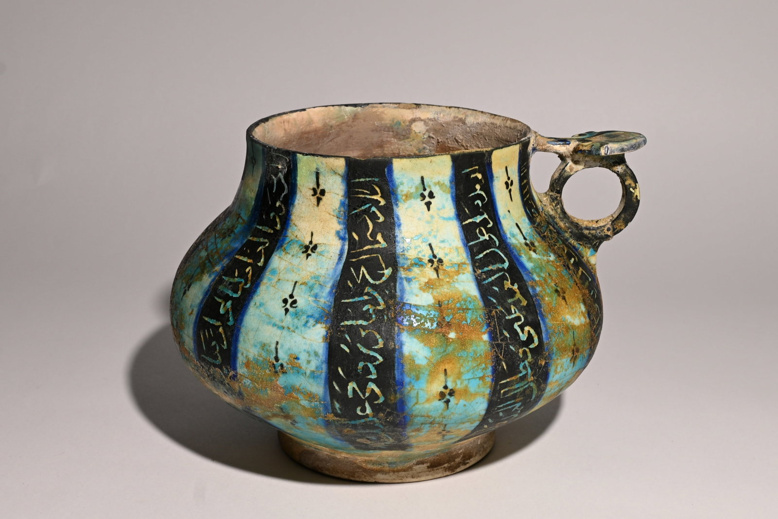 A Kashan underglaze-painted pottery jug Persia, 12th Century (1 of 7)
