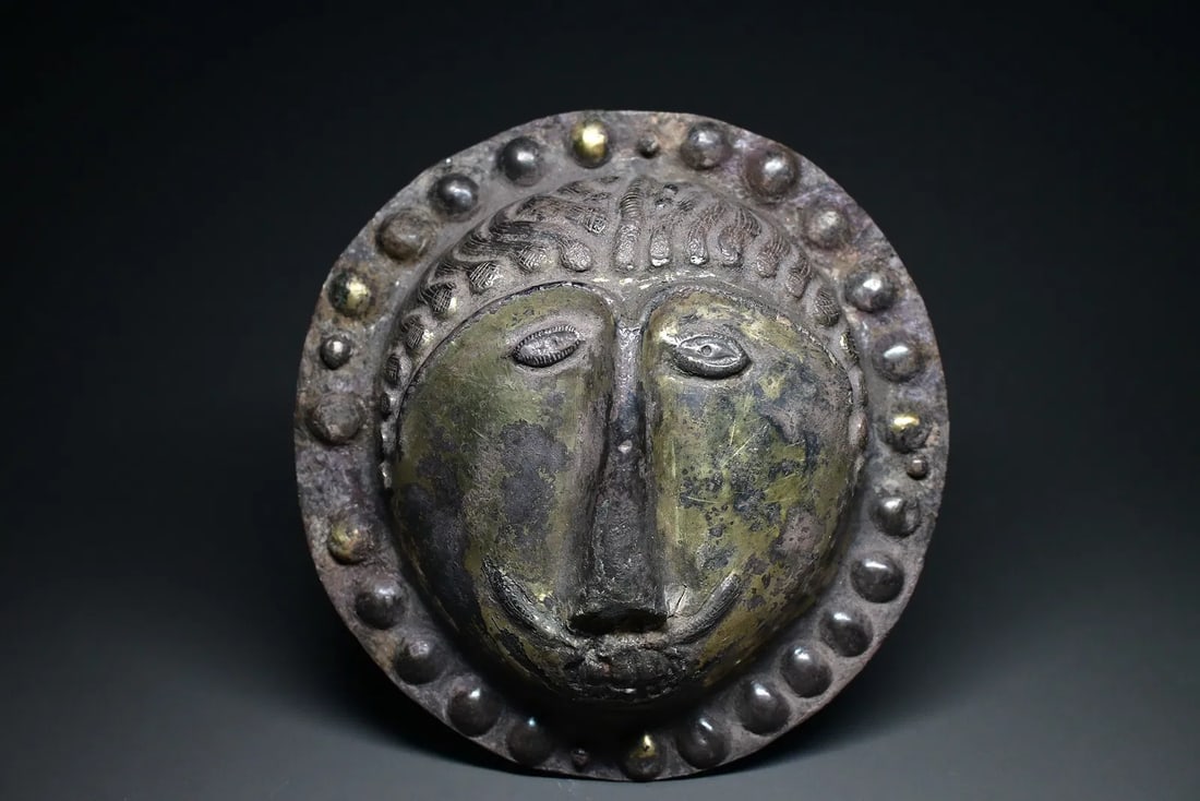 rare Sasanian silver lion-head boss, Persia, circa 4th–6th century CE: rare Sasanian silver lion-head boss, Persia, circa 4th–6th century CE. The domed repoussé face is rendered with stylized almond-shaped eyes, pronounced nose, and finely detailed mane, surrounded by
