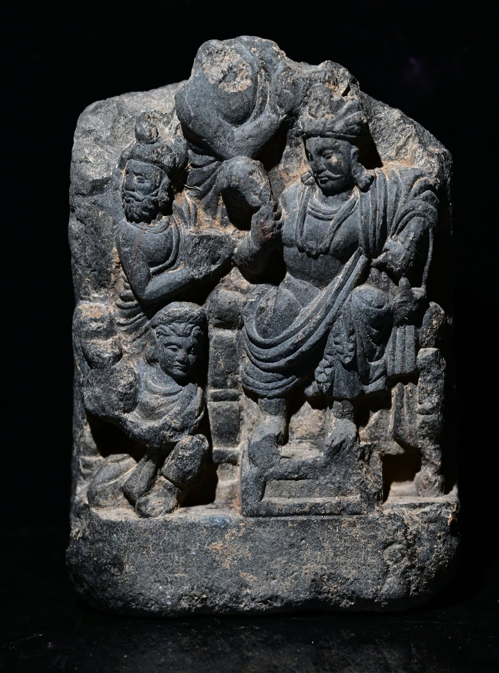 Gray Schist Relief Depicting Bodhisattva, Gandhara, 2nd–4th century A.D.: Gray Schist Relief Depicting Bodhisattva, Gandhara, 2nd–4th century A.D.Size: 15.5cm H x 10.5cm x 5cm thick. Provenance: property of an european collector, acquired in early 1990s