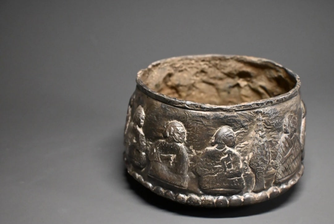 Elamite or Mesopotamian Repoussé Silver Bowl: Elamite or Mesopotamian Repoussé Silver Bowl2nd–1st Millennium B.C.A finely hammered silver bowl of deep cylindrical form, its exterior richly decorated in repoussé with a continuous frieze of