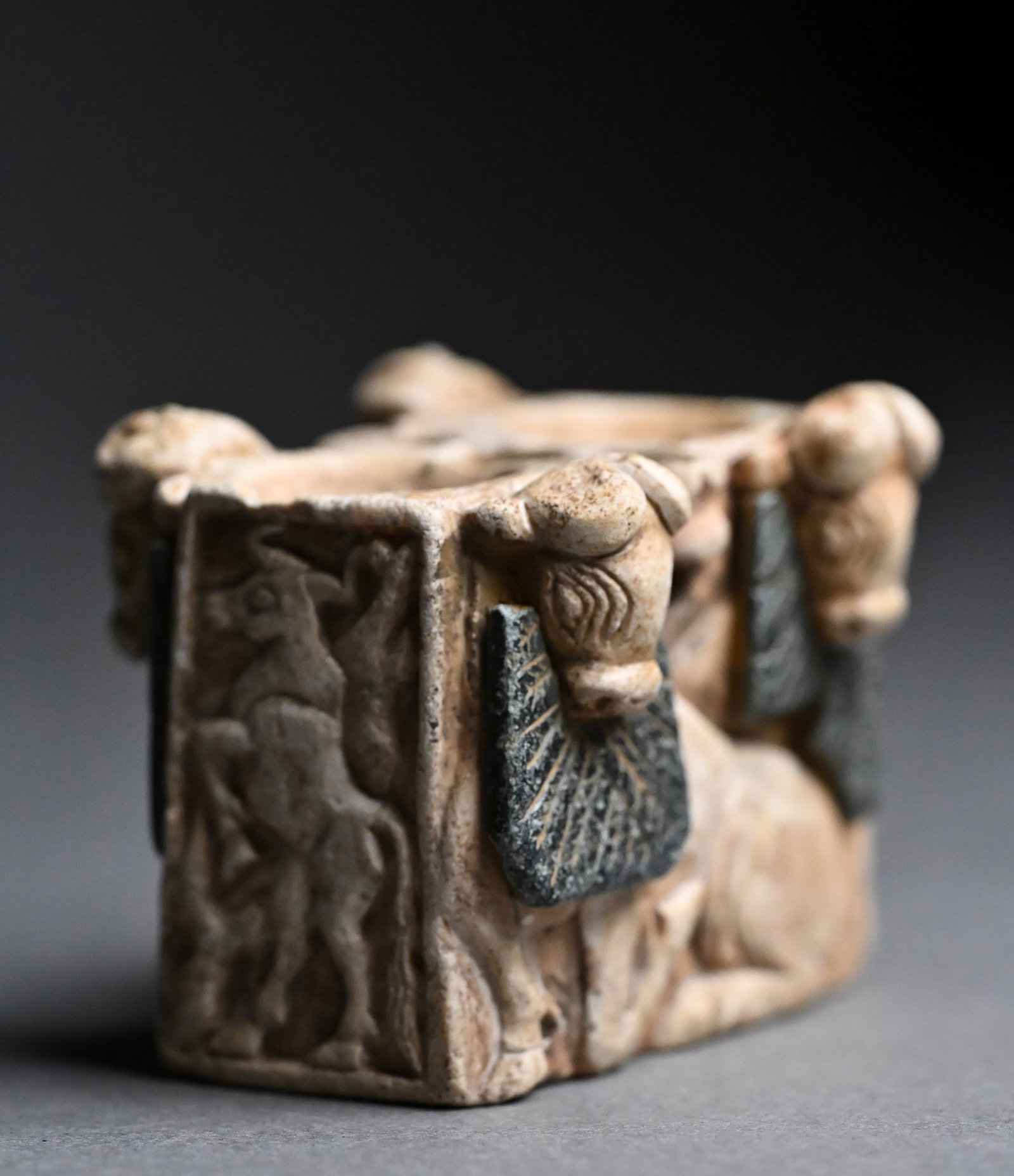 Mesopotamian Limestone Cosmetic or Ink Vessel: Mesopotamian Limestone Cosmetic or Ink Vessel with Bull DecorationMesopotamia, Circa 2nd Millennium B.C.A finely carved Mesopotamian limestone cosmetic or ink vessel of rectangular form, decorated