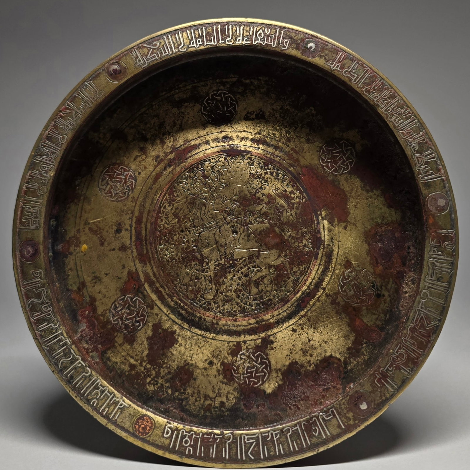 A KHORASSAN SILVER AND COPPER- INLAID BRONZE DISH NORTH EAST IRAN, 12TH C (1 of 9)