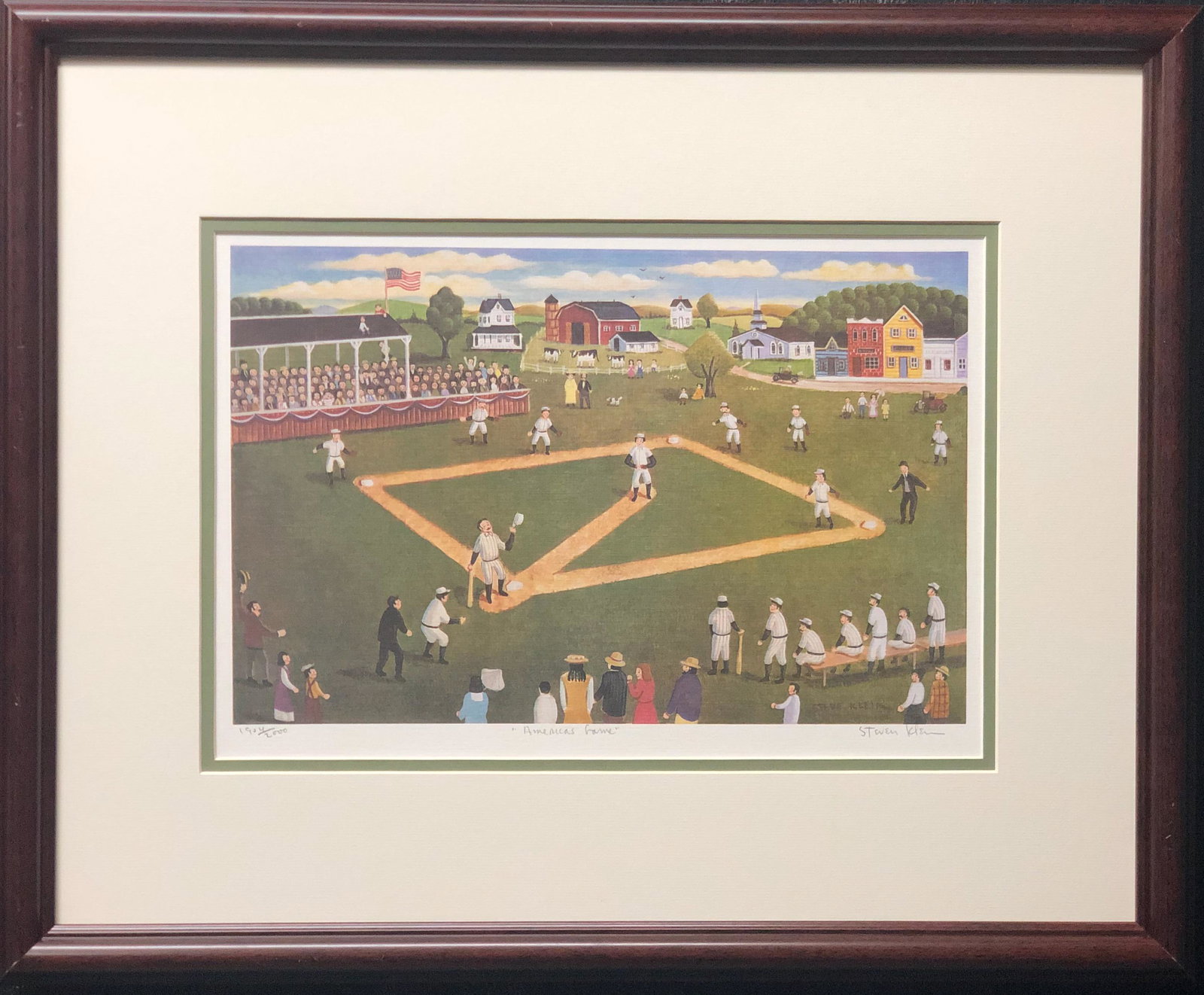 STEVEN KLEIN "AMERICA'S GAME": HAND SIGNED AND NUMBERED LITHOGRAPH.FRAMED IN BROWN AND DOUBLE MATTED. Steven Klein is an American primitive artist living in Long Island. Artist Quote "I choose to paint in my own stylized version of