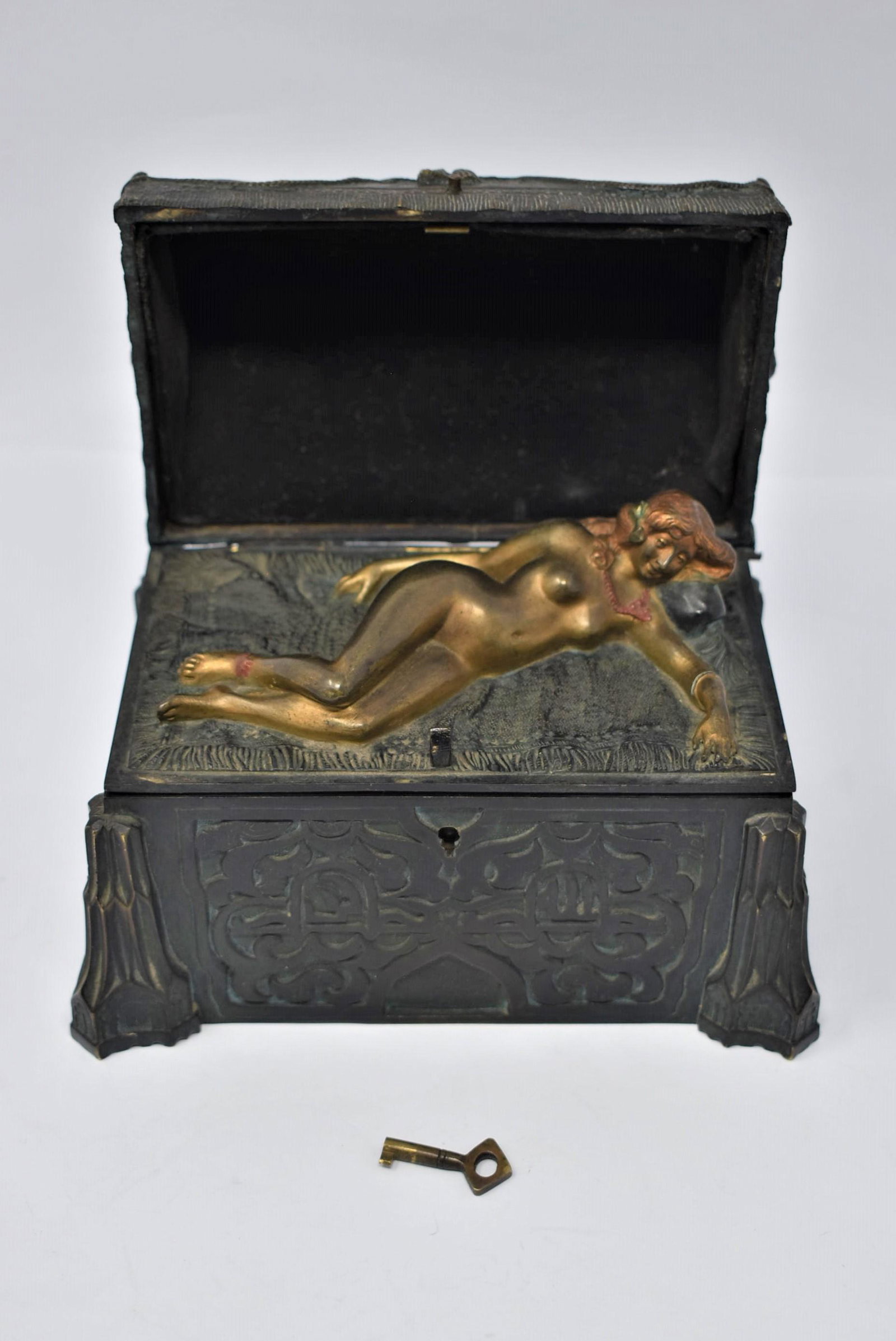 Antique Viennese Erotic bronze casket marked Titze: An antique circa 1900 erotic bronze marked "Titze" and " Vienna" on the underside.The green patinated bronze trunk features a secret compartment inside the lid which opens to reveal a reclining nude b