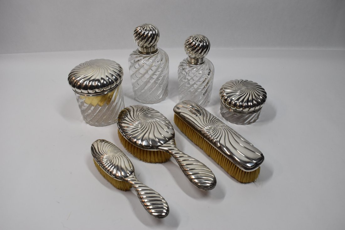 Antique French silver vanity set by Alphonse Debain: Outstanding French silver mounted glass seven-piece vanity set circa 1900. Retailed by Boudet, maker's mark of Alphonse Debain ( a woodstock between an A and a D in a horizontal diamond), French hallm