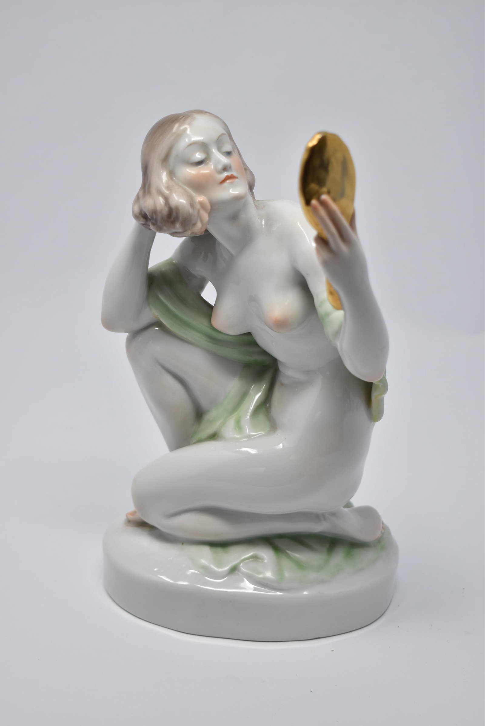 Herend Porcelain figure of a female nude: Herend porcelain figure of a nude woman holding a hand mirror, Hungary, 20th century Signed Istvan Szilagyi Nagy. Factory marks and numbered 5724 on the underside. Approximate measurements: 9.25"H x 4