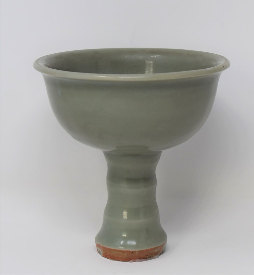 Chinese Longquan celadon-glazed stem bowl: A Chinese Longquan, Yuan/ Ming Dynasty celadon glazed stem bowl. From the Maria Anglesio collection, thence by descent to the present owner. Approximate measurements:5.25"H x 5.25" in diameter In-hous