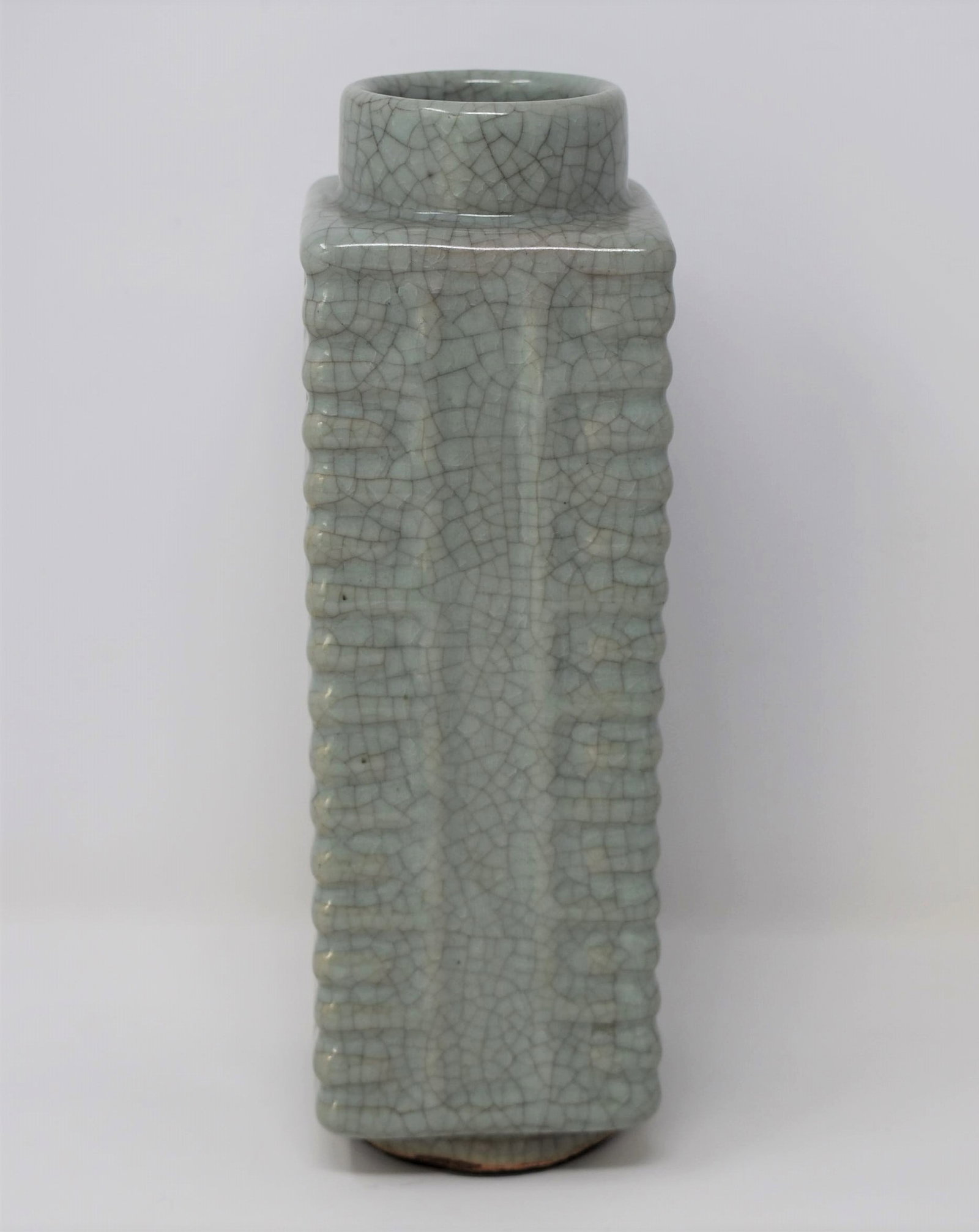 A Chinese celadon glazed cong vase: A Chinese Qing dynasty crakled celadon glaze cong vase.from the Maria Anglesio collection, thence by descent to the present owner. Approximate measurements: 10.25"H x 3.23"w x 3.25" d In-house domesti