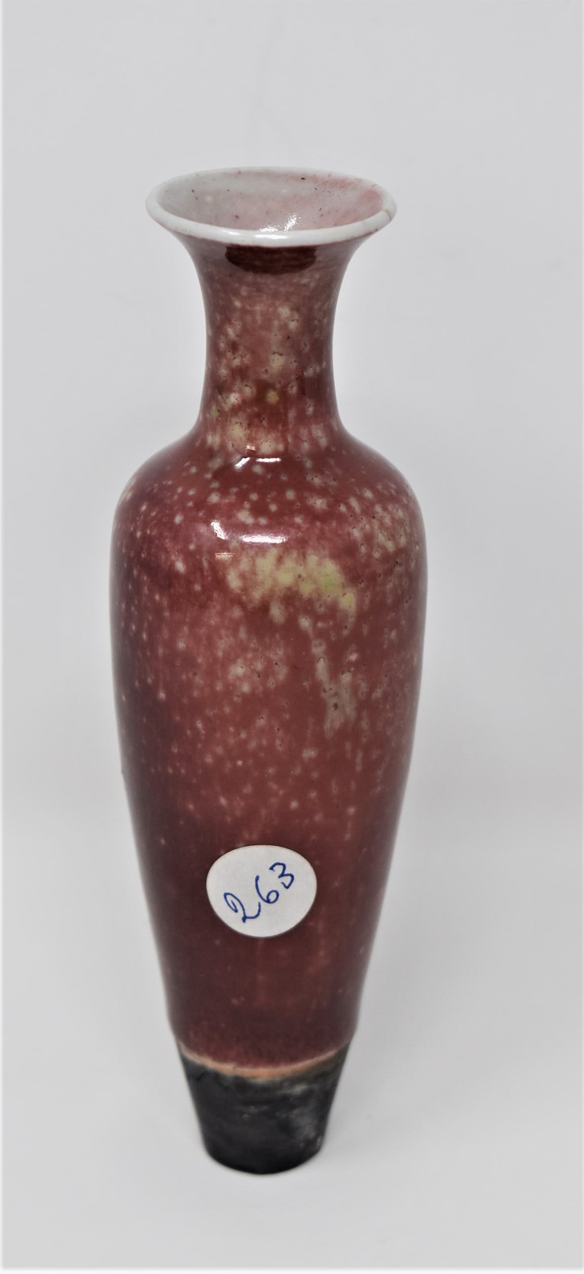 A small Chinese porcelain peach bloom glaze amphora vase: A small Chinese porcelain peach bloom glazed amphora vase with a mottled pinkish-brown glaze that falls short of the foot rim to reveal the body, the rim is glazed brown. Missing the underside (no bot