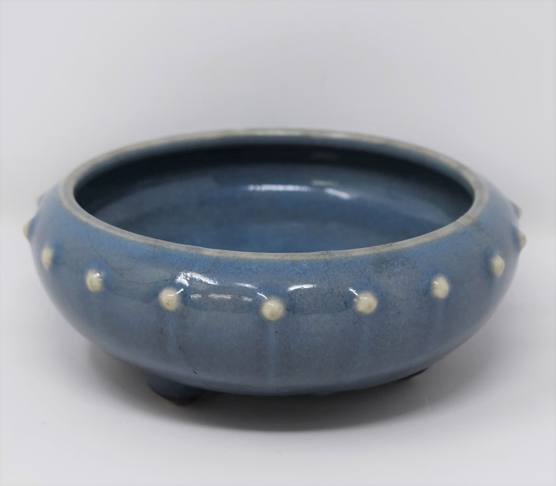A Chinese blue glazed tripod narcissus bowl: A Chinese antique or vintage early Ming dynasty style narcissus bowl. From the Maria Anglesio collection, thence by descent to the present owner. Approximate measurements: 2.25"H x 6" in diameter In-h