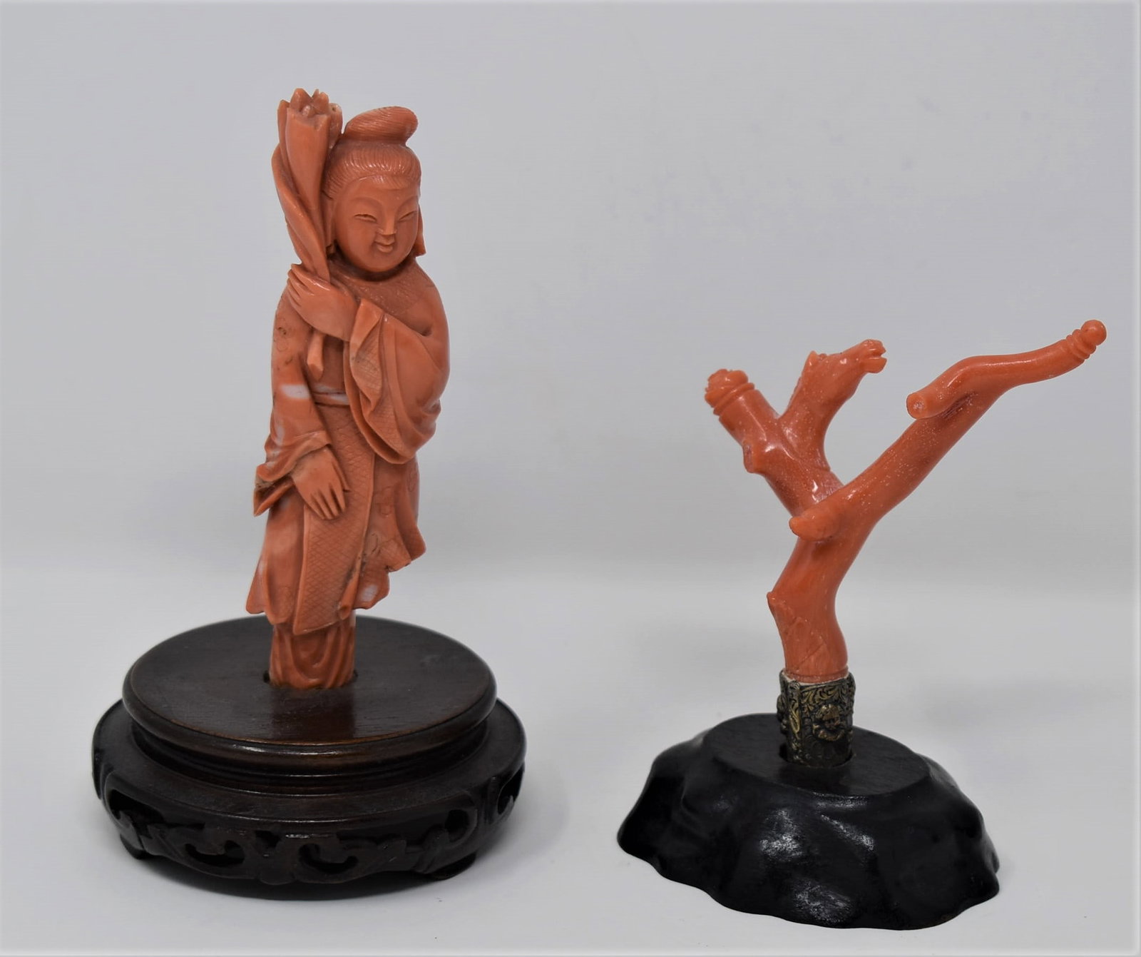 Grouping of two antique /vintage Chinese coral carvings: A grouping of two antique / vintage Chrinese coral carvings including a carving of a girl holding a lotus flower ( 5.5" H including base and gross weight: 117 g) and a small vintage Chinese coral carv
