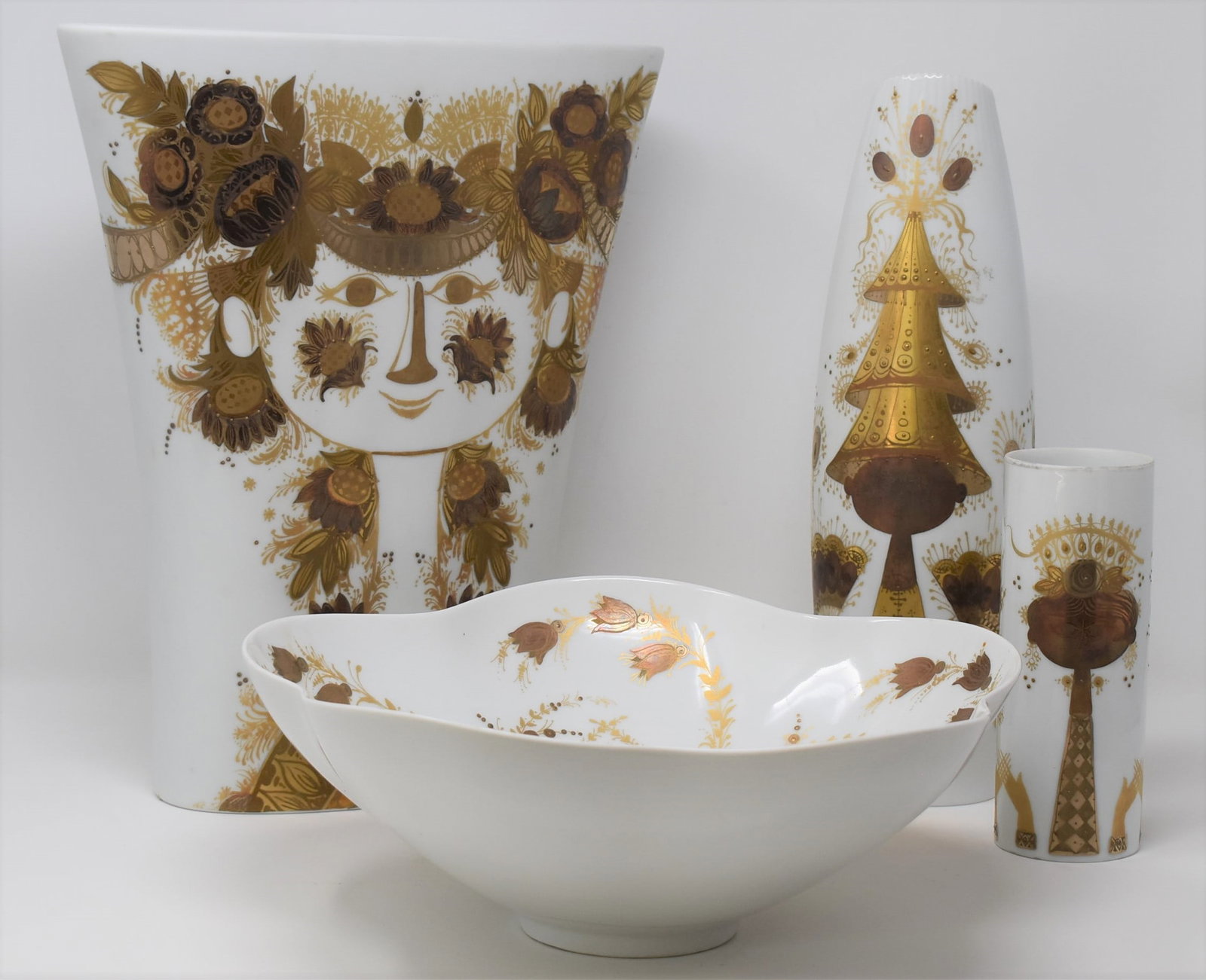 Grouping of four Bjorn Wiinblad for Rosenthal porcelain items: A grouping of four Bjorn Wiinblad for Rosenthal porcelain items including a large vase ( 12.75"H x 10.75"W x 3.5"D), a large bowl ( 4"H x 11" in diameter), a tall vase (12.25"H x 3.75"W x 3"D) and a s
