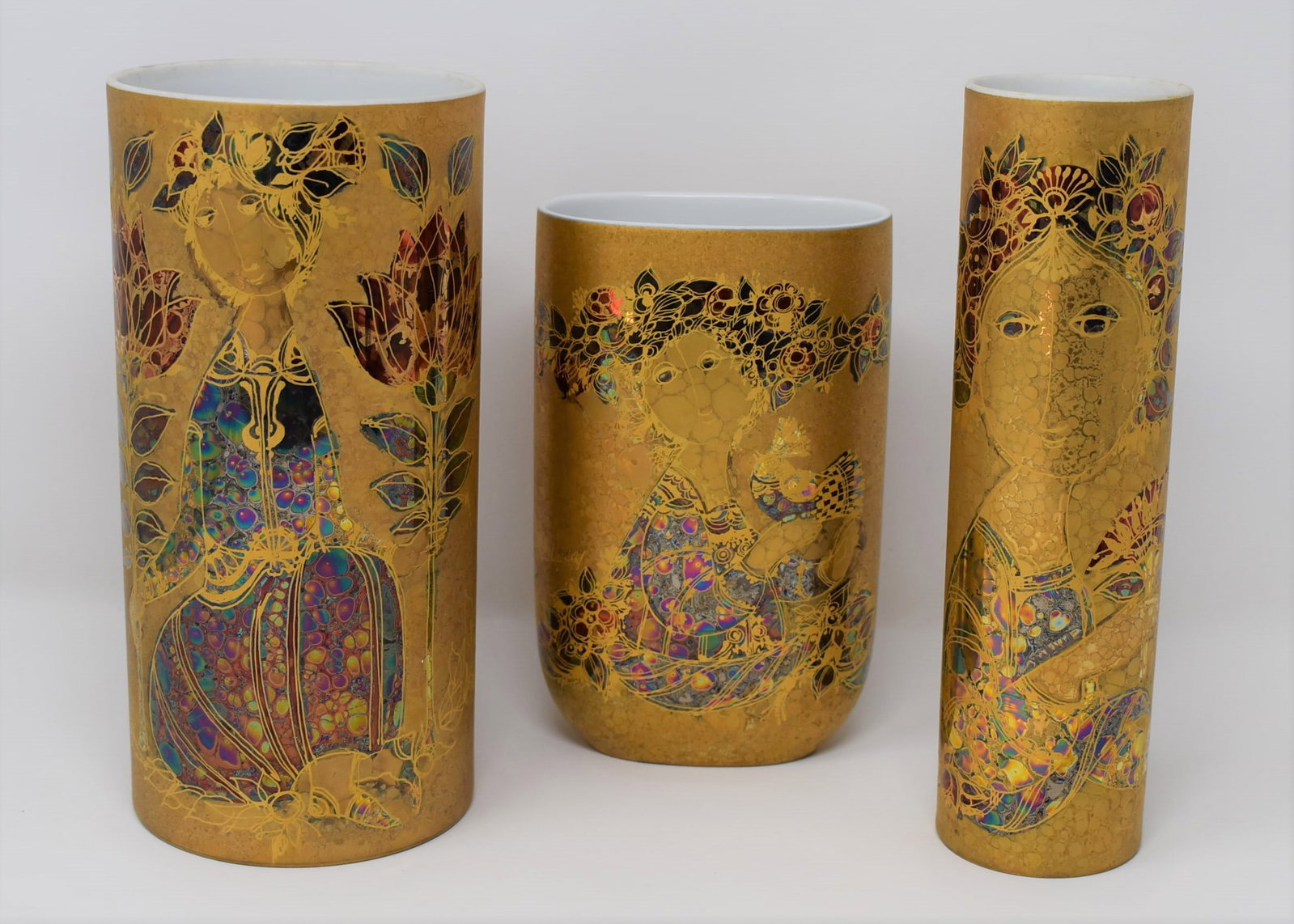 Grouping of three Bjorn Wiinblad for Rosenthal gilt vases: A grouping of three Bjorn Wiinblad for Rosenthal porcelain gilt decorated Studie Linie vases. From a Dix Hills, NY estate. Measurements: 8.75Hh x 4.25" in diameter, 9"H x 2.5" in diameter, and 7.25"H 