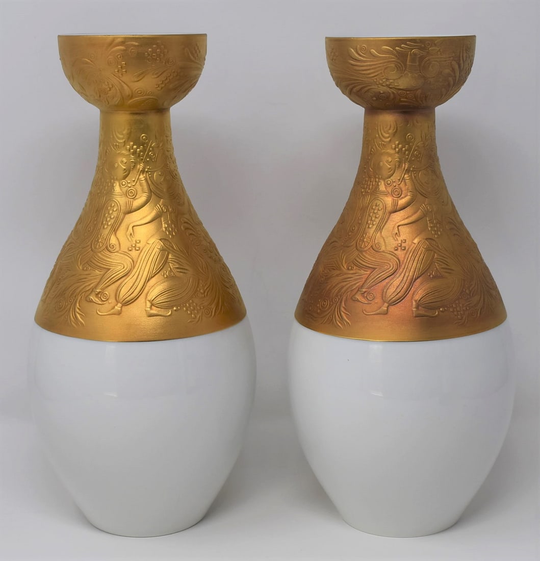 Pair of Bjorn Wiinblad for Rosenthal porcelain " magic Flute" vases: A tall pair of vintage Bjorn Wiinblad for Rosenthal porcelain vases in the "die zauberflote' or " magic flute" pattern. From a Dix Hills, NY estate. Approximate measurements: 11.75"H x 5.5" in diamete