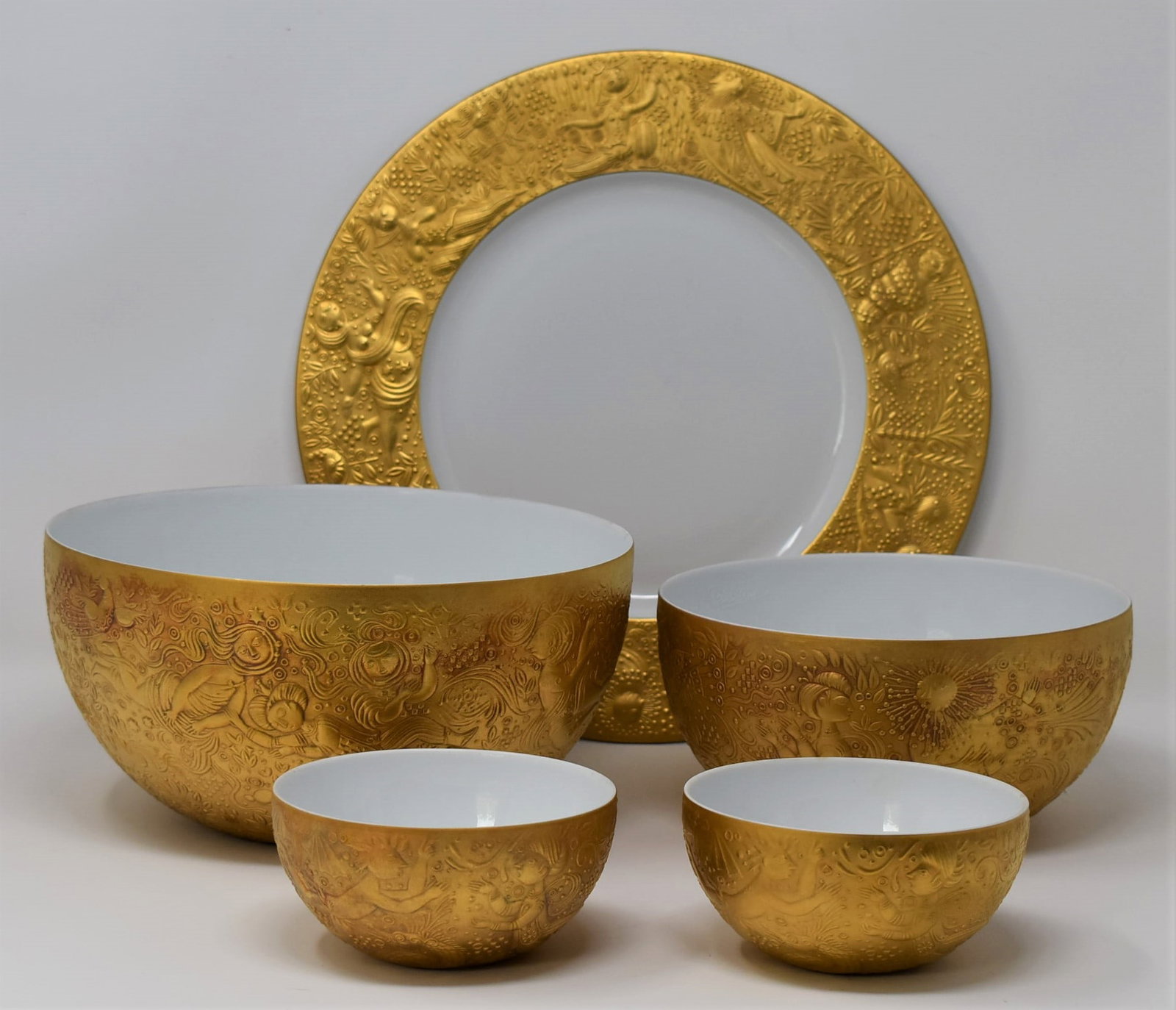 Grouping of Bjorn Wiinblad for Rosenthal" magic flute" porcelain: A grouping of five porcelain items in the " Die Zauberflote " or " magic flute " pattern designed by Bjorn Wiinblad for Rosenthal. Includes a dinner plate ( 11.25" in diameter), a large bowl ( 4.25"h 