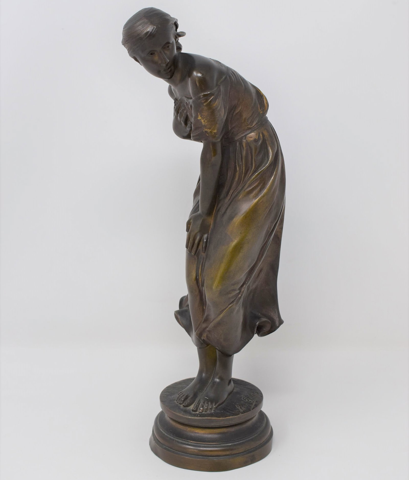 LEON PILET, Antique French bronze of a maiden: " Le coup de vent": An antique French bronze of a maiden sined Leon Pilet ( French 1836-1916). This particular bronze is titled " le coup de vent" and was first exhibited during the Paris Universal Exposition of 1888. Ap