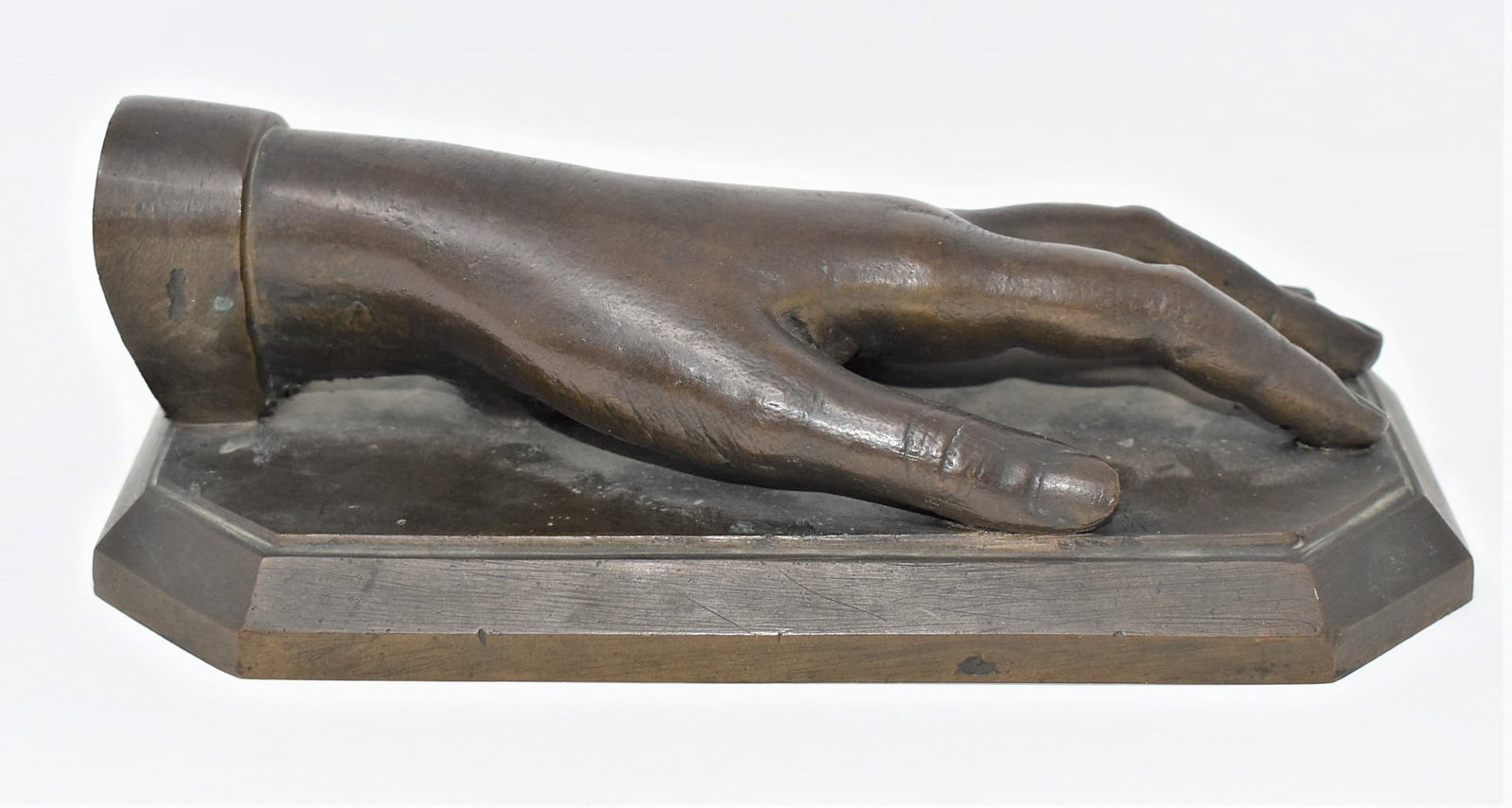 Antique signed bronze of a hand: An antique bronze sculpture of a hand with a dark brown patina finish. Signed " Lorenzo" on the base. Measurements: 3"H x 8.75"L x 4.75"D In-house domestic shipping is available for this lot. Shipping