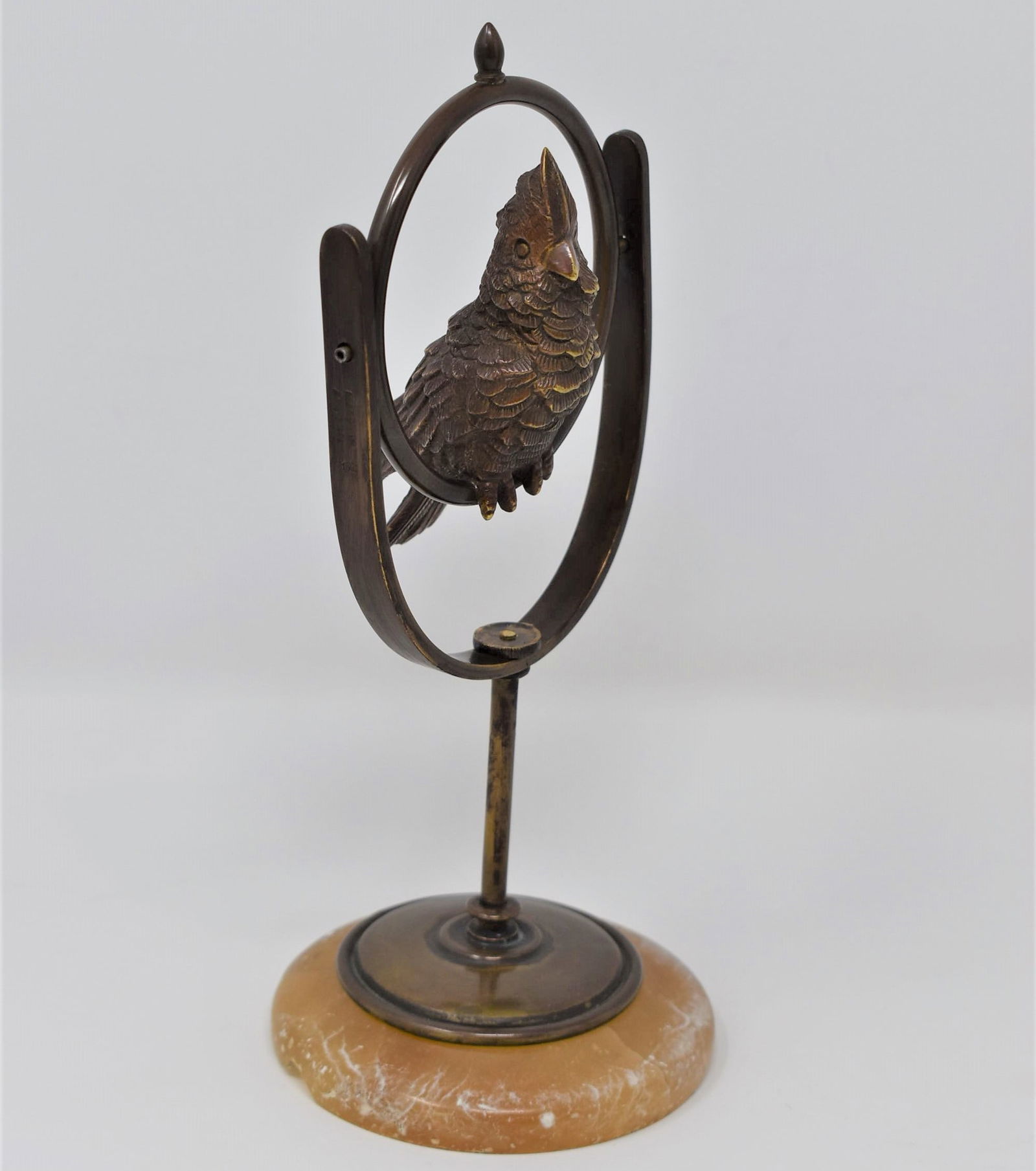 Signed BERGMAN miniature bronze cockatoo on perch: An antique Viennese miniature bronze cockatoo on perch signed Bergman. Marked with the mark of franz Bergman and " made in Austria" on the side of the perch. Original circular alabaster base. Approxim