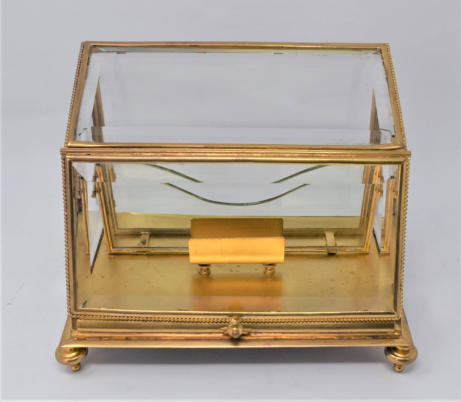 Antique Gilt brass vitrine / letter rack desk case: An antique, gilt brass and beveled glass vitrine / document/ letter rack desk case. Early 20th century, probably French. Approximate measurements: 6.5"H x 10"L x 7"D In-house domestic shipping is avai