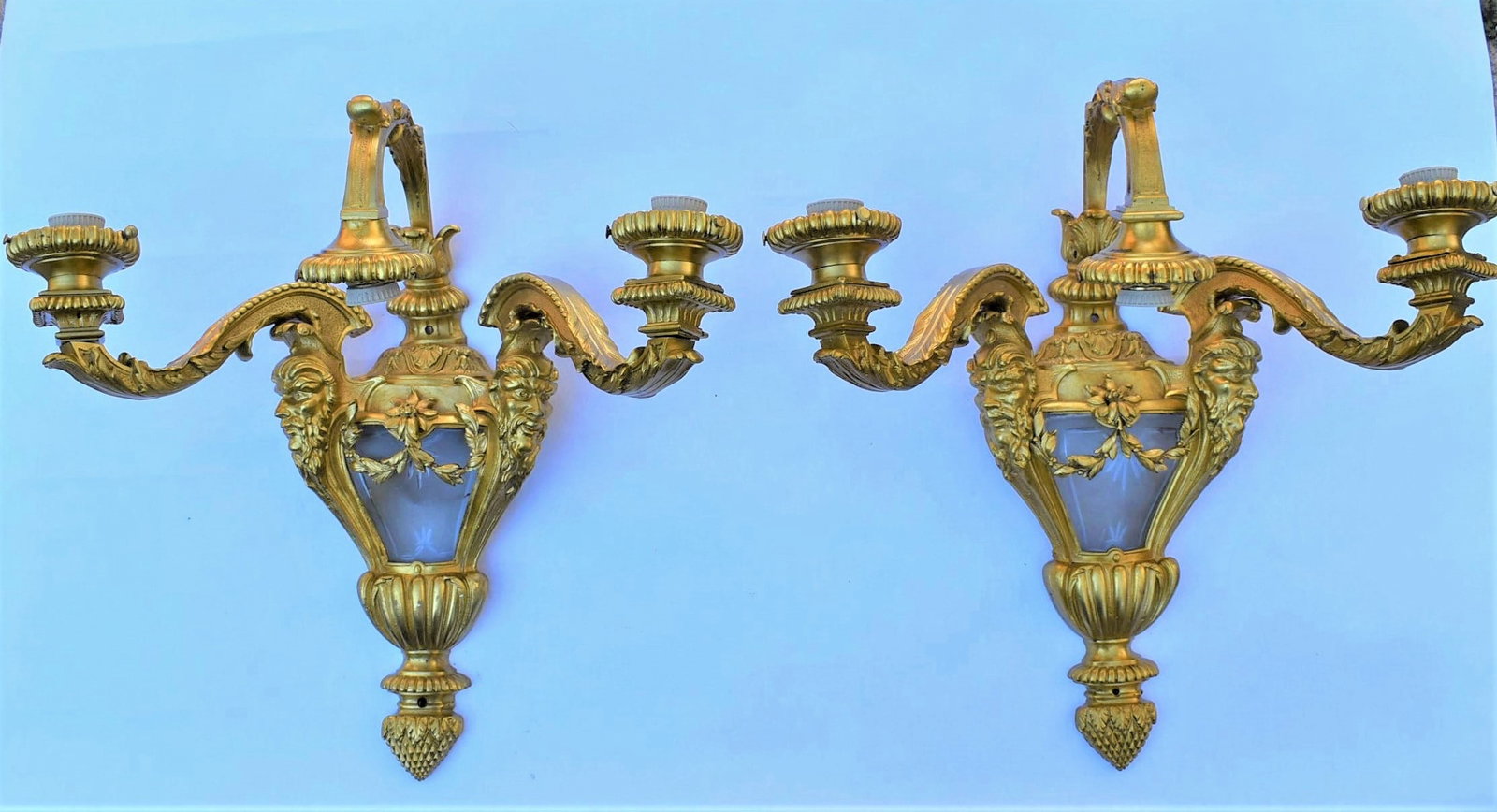 A pair of large and heavy gilt bronze and glass 3-arm sconces: A pair of large and heavy gilt bronze and glass 3-arm sconces / wall light / appliques. Early to mid-20th century. Approximate measurements: 20"H x 20"W x 9"D Deker Auctions will not perform any shipp