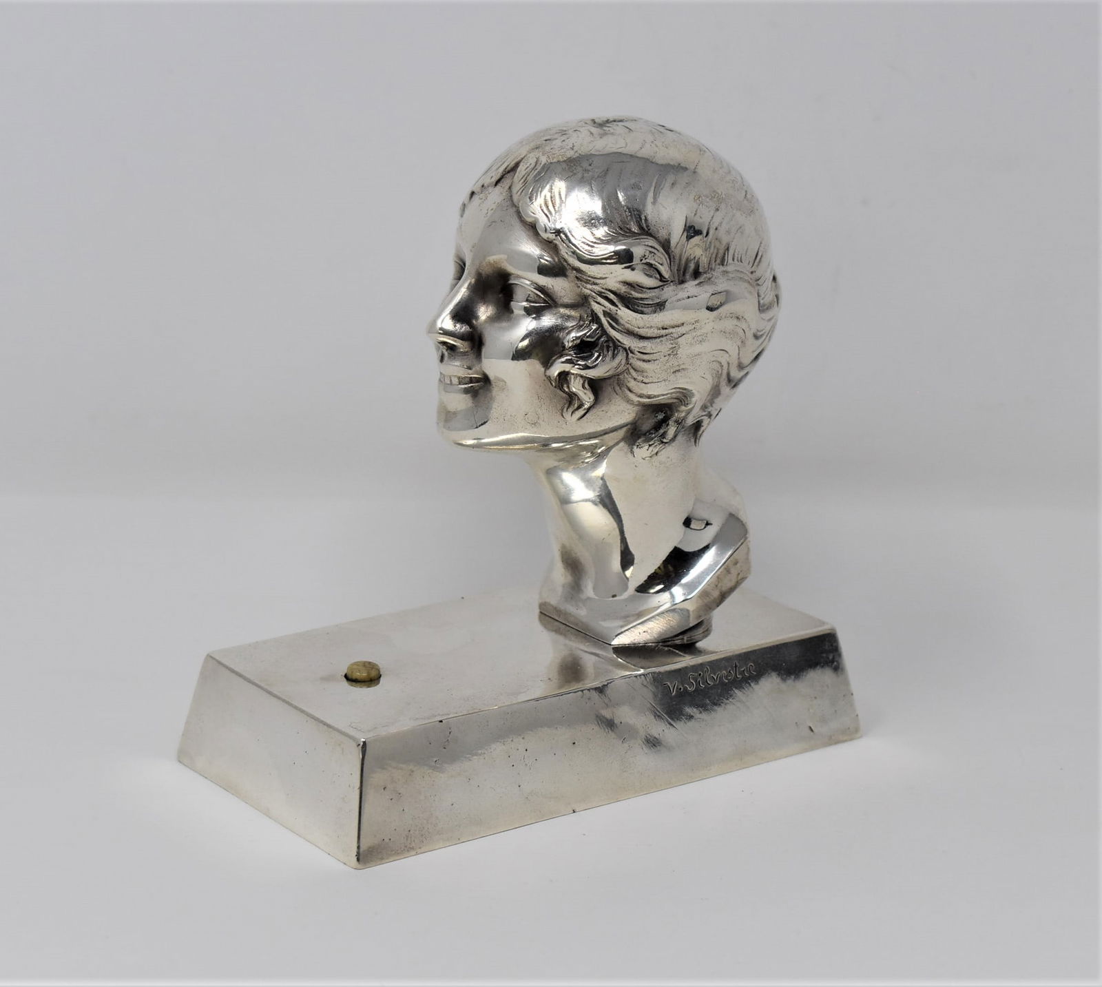 SILVESTRE for Susse Freres Art Deco Figural bronze bell push: An Art Deco period French silver plated bronze figural bronze bell push signed " V. Silvetre" for Victor Silvestre and cast by Susse Freres, Paris. Circa 1930. Approximate measurements: 5.25"H x 5"w x