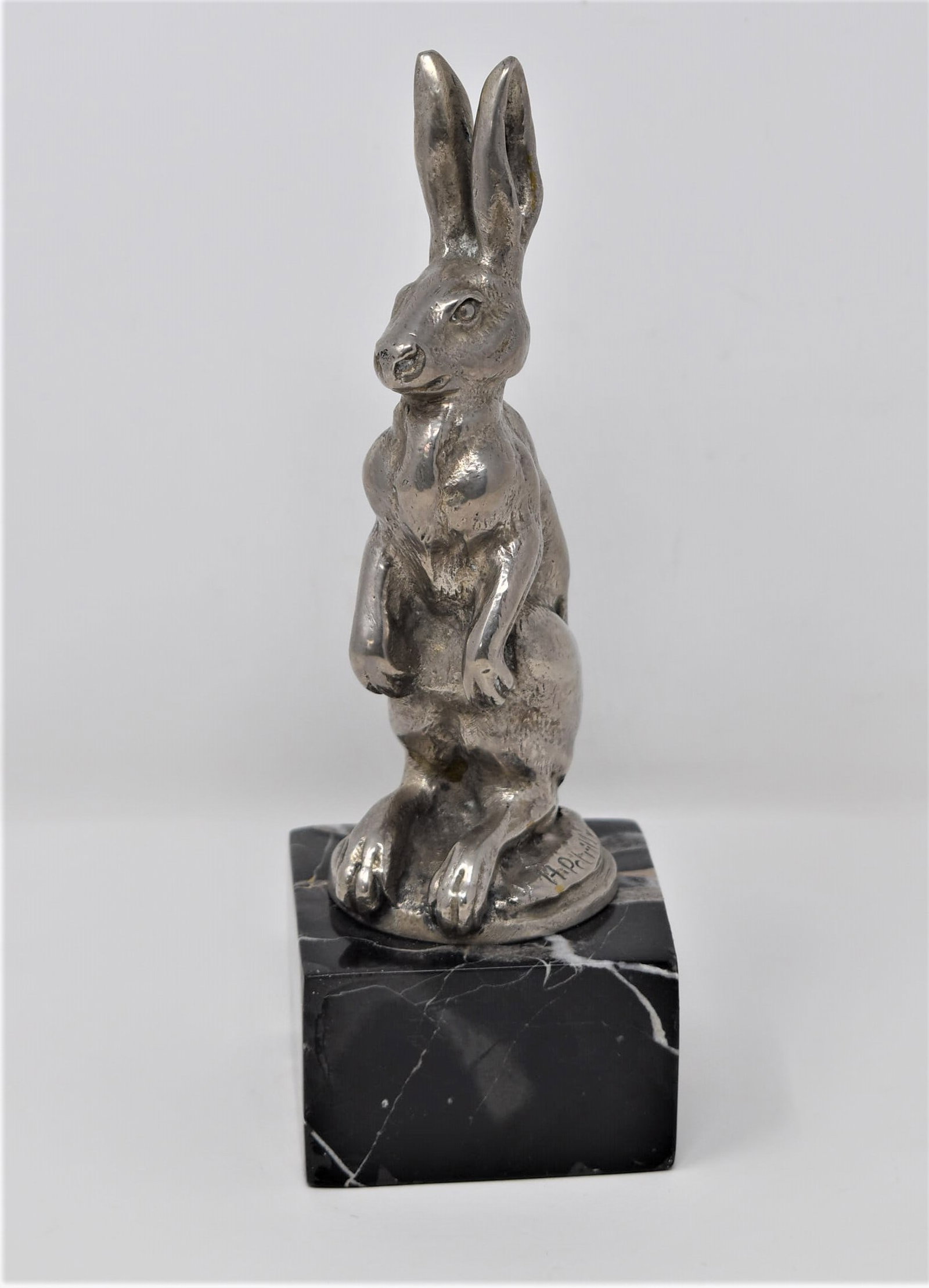 Rare H. PETRILLY Art Deco "hare" car mascot: A rare Art Deco nicke- plated bronze hare-form car mascot circa signed "H. Petrilly" on base. France, circa 1925. Later mounted on a square marble base. Approximate measurements ( total height, includ