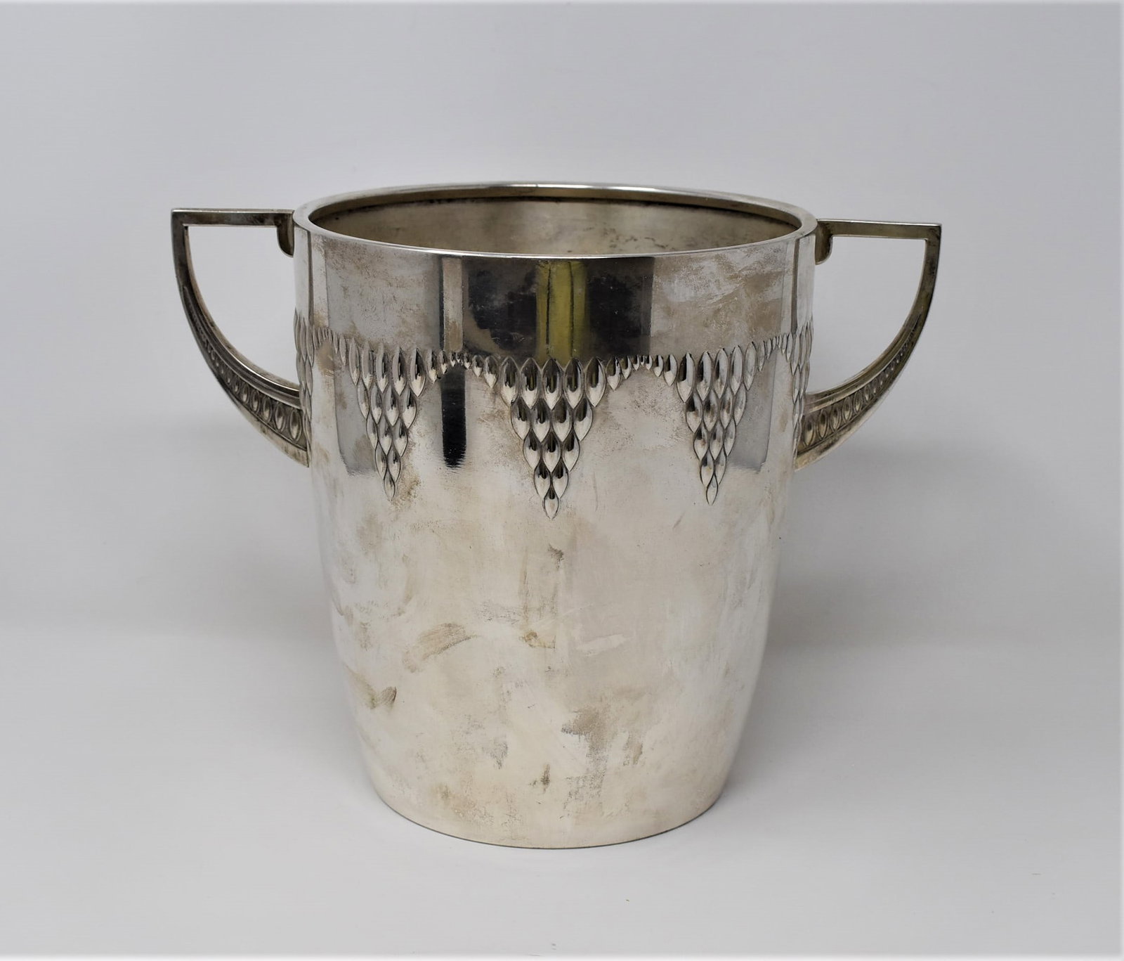 Art deco silver plated brass WMF wine / champagne cooler: A German Art Deco period silver plated brass wine cooler. Marks of WMF on the underside. Circa 1930. Approximate measurements: 8.25"H x 10.25" W x 7.5"D In-house domestic shipping is available for thi