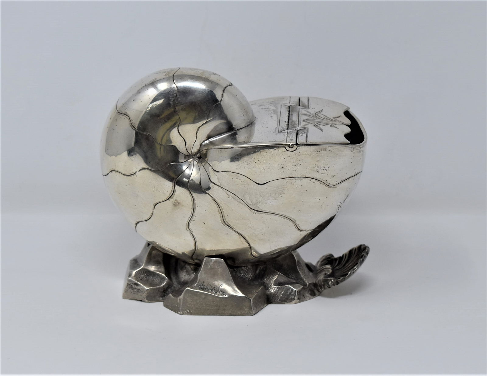 Antique Christofle silver-plate nautilus spoon warmer: A rare antique Christofle English-style Nautilus-form spoon warmer, Stamped" Christofle", stamped with the Christofle scale-form mark and numbered "2176". Circa 1900. Approximate measurements: 5.5"H x