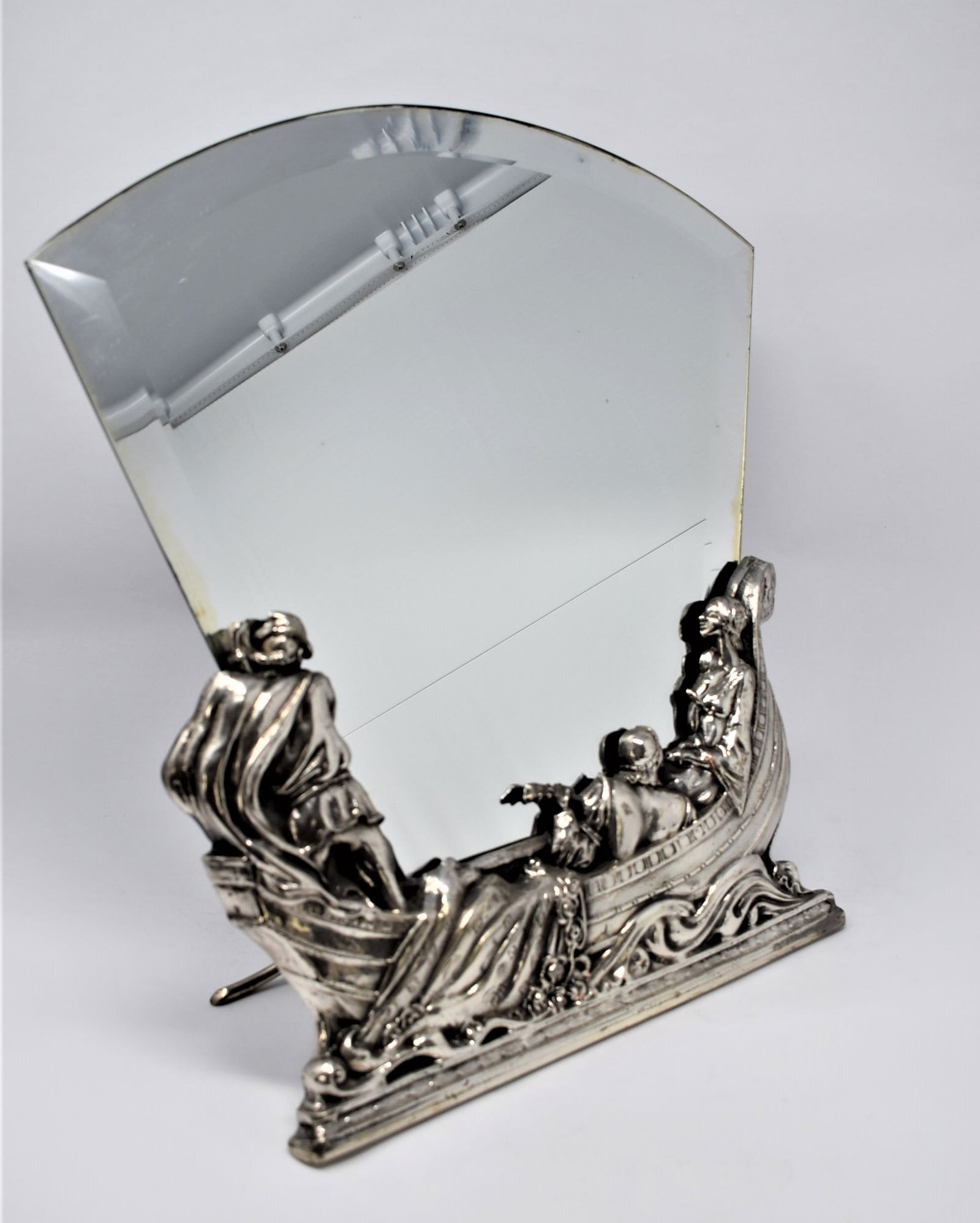 German Art Nouveau figural table mirror by WMF: An Art Nouveau period figral table mirror by WMF circa 1905. Marked on the back with the patina in very good condition. WMF ostrich mark as well as " O' and "OX". Approximate measurements: 15.75"H x 1