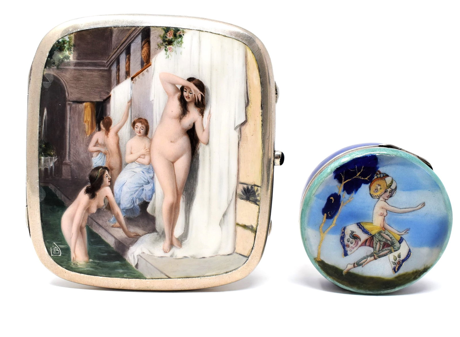 Two silver and enamel decorated cases with erotic decoration: Two antique or vintage continental silver and enamel cases with erotic motifs including a German or Austrian marked "800" silver cigarette case with a signed enamel decoration featuring nude bathing b
