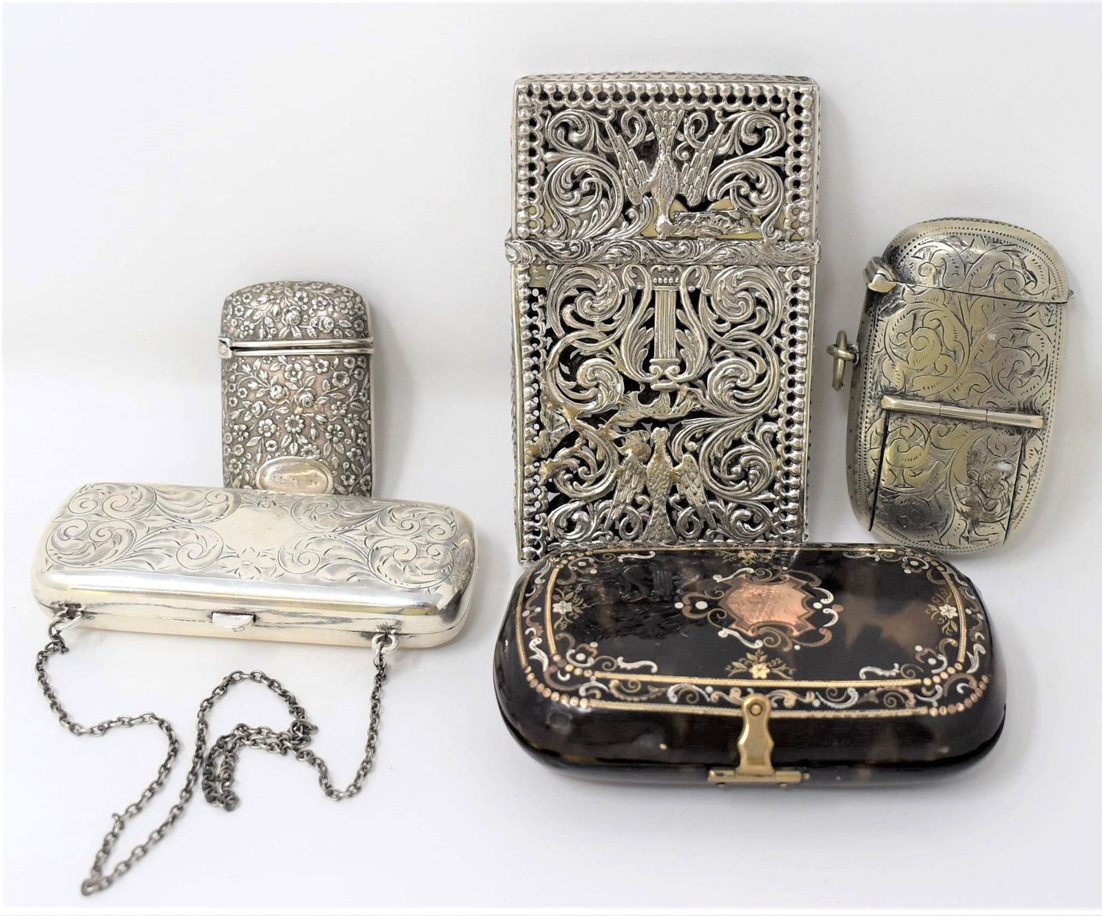 Grouping of 5 Continental cases, including silver (1 of 20)
