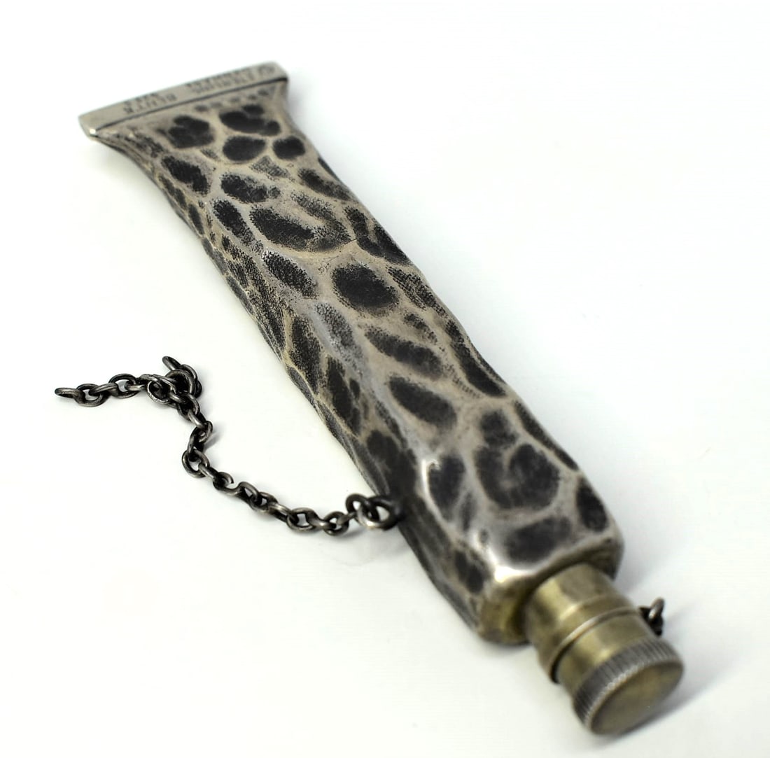 Unusual Sterling silver paint tube-form scent bottle: Unusual vintage Danish Sterling silver paint tube-form scent bottle. Marked "Denmark Sterling", "925 S" and " Bent K" for Bent Knudsen. Mark possibly apocryphal. Approximate measurements: 3.5"H x 1"W