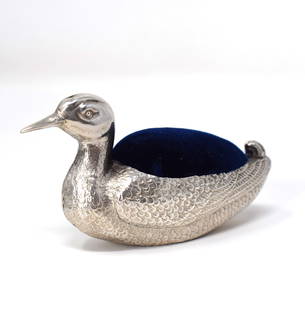 Edwardian novelty sterling silver Duck pin cushion: Edwardian novelty sterling silver Duck pin cushion, stamped with Chester Hallmarks, date letter for 1910 and maker's mark for Sampson, Mordan & Co. 1 3/4"h x 3 1/2"W x 1"d or 4.5cm H x 9cm w x 2.5cmD