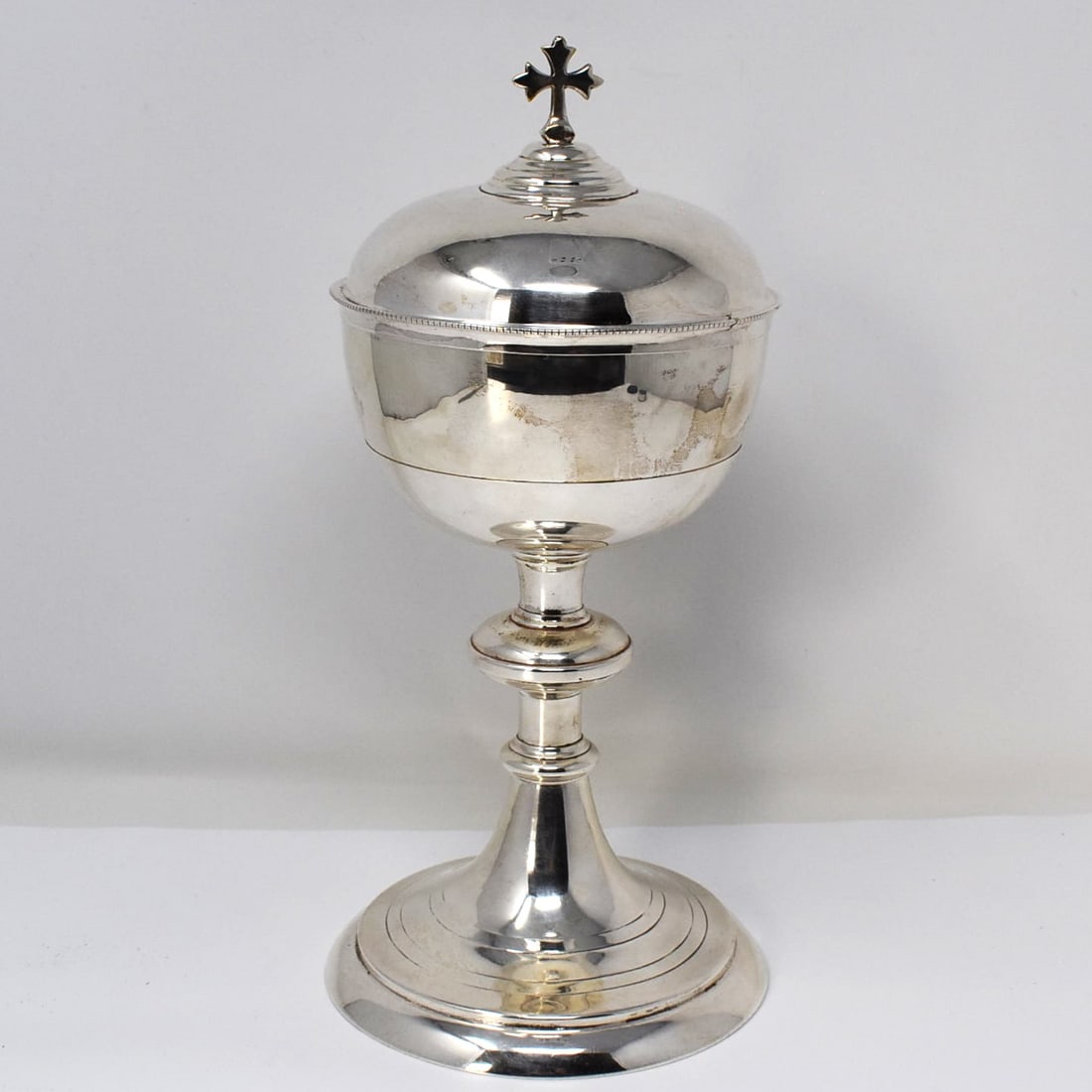Vintage silver-plate ciborium: Vintage silver-plate ciborium with gold wash interior. Approximate measurements: 10 1/2"H x 5" in diameter