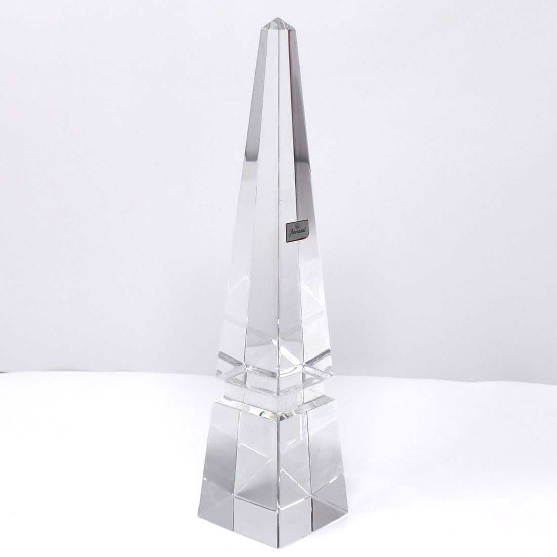 Baccarat crystal Luxor 10" obelisk in original padded box: A Baccarat, France crystal 10" high Luxor Obelisk desk ornament in its original box. Engraved with " MRCC 1989 Runner-up Club Championship". Acid etched baccarat mark at the bottom and Baccarat on the