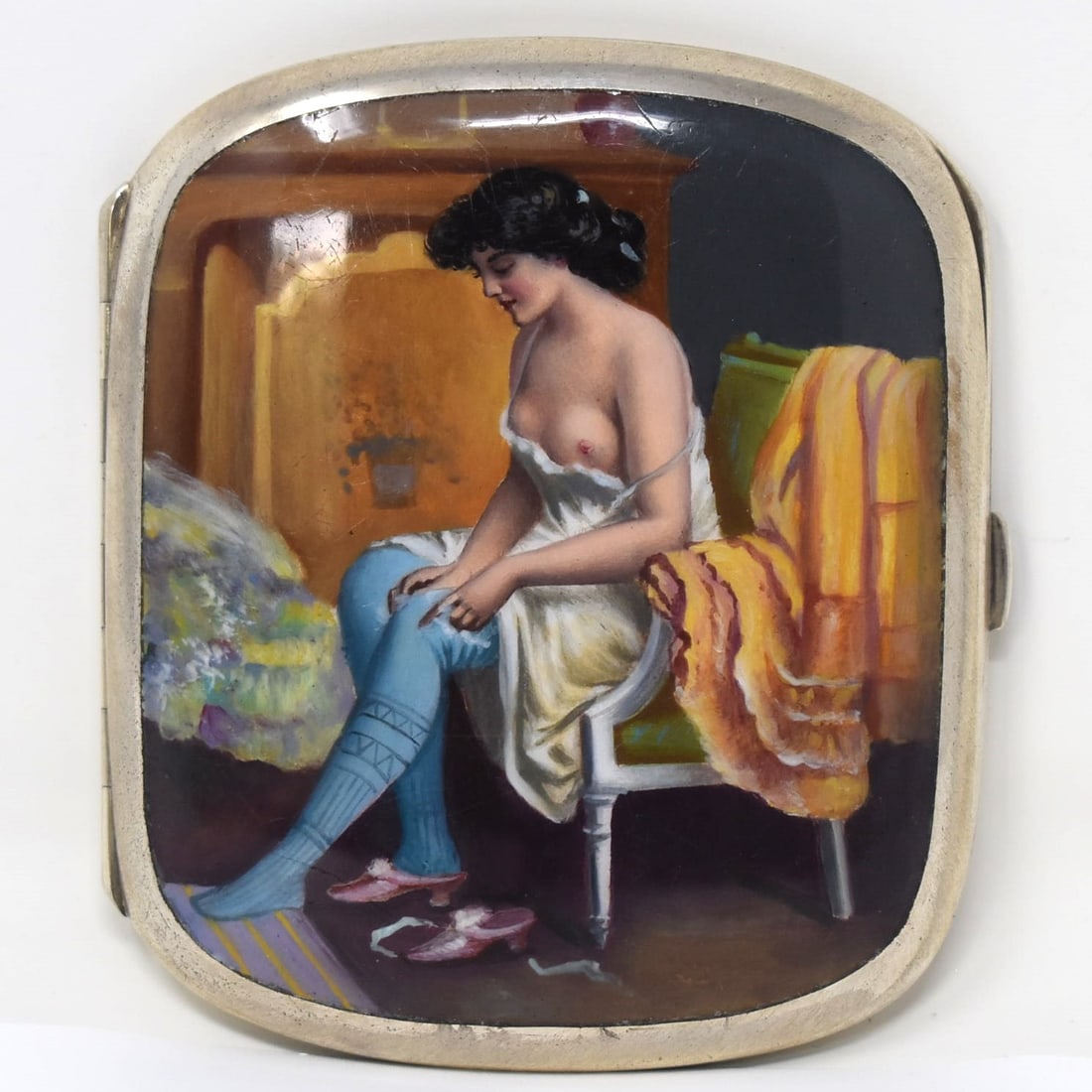 Erotic silver and enamel case: An antique or vintage erotic 900 silver and hand-painted enamel cigarette case featuring a semi-nude beauty undressing in her boudoir. Probably Austrian. No apparent hallmarks or maker's marks but eng