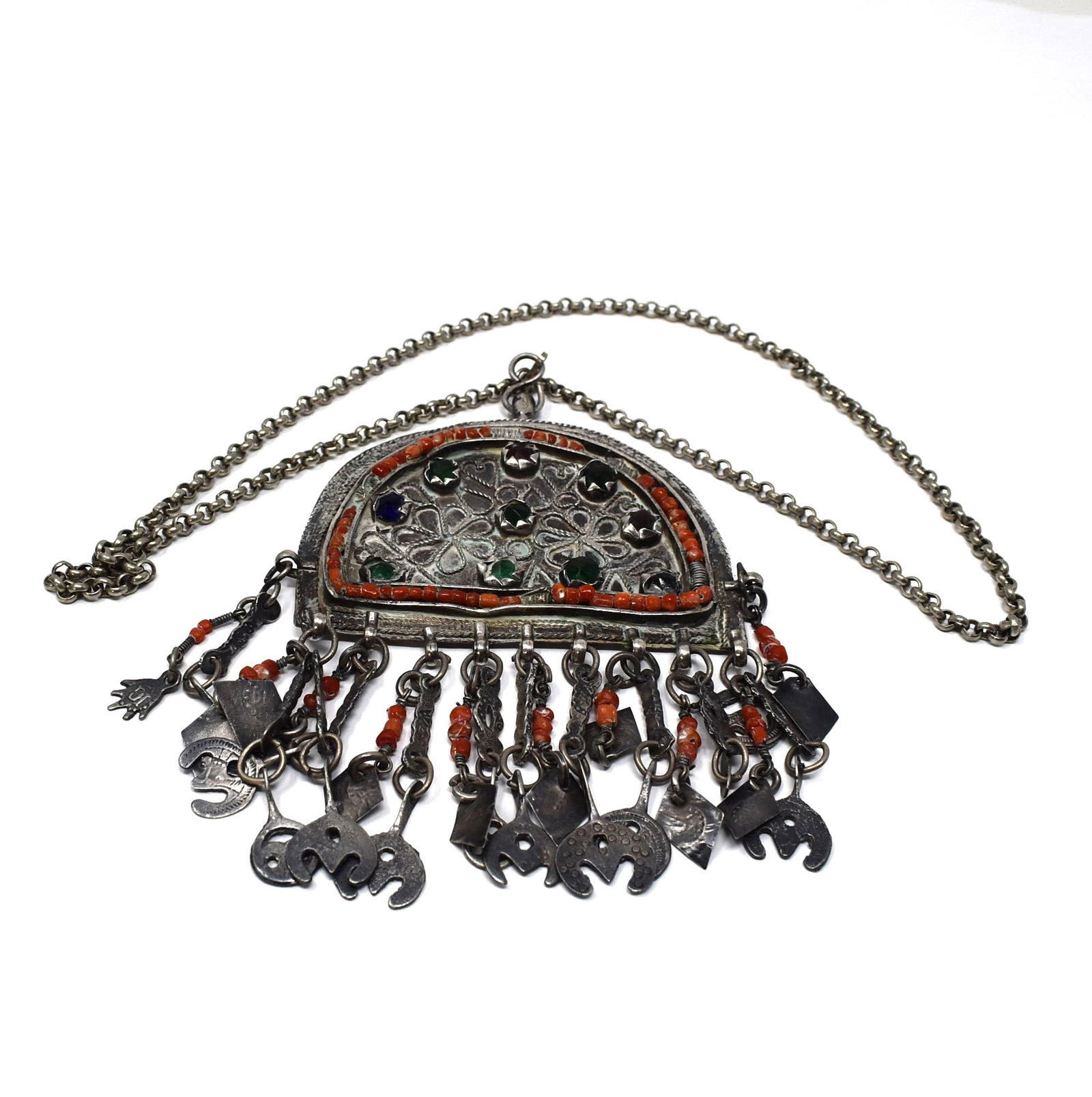 Morocco Berber bejewelled Silver and coral pendant necklace: An antique or vintage Morrocan, Berber traditional bejewelled silver pendant necklace with coral beads. Gross weight: 189g or 6.66 Oz. Approximate measurements( pendant only, for scale): 5"H x 4" W or
