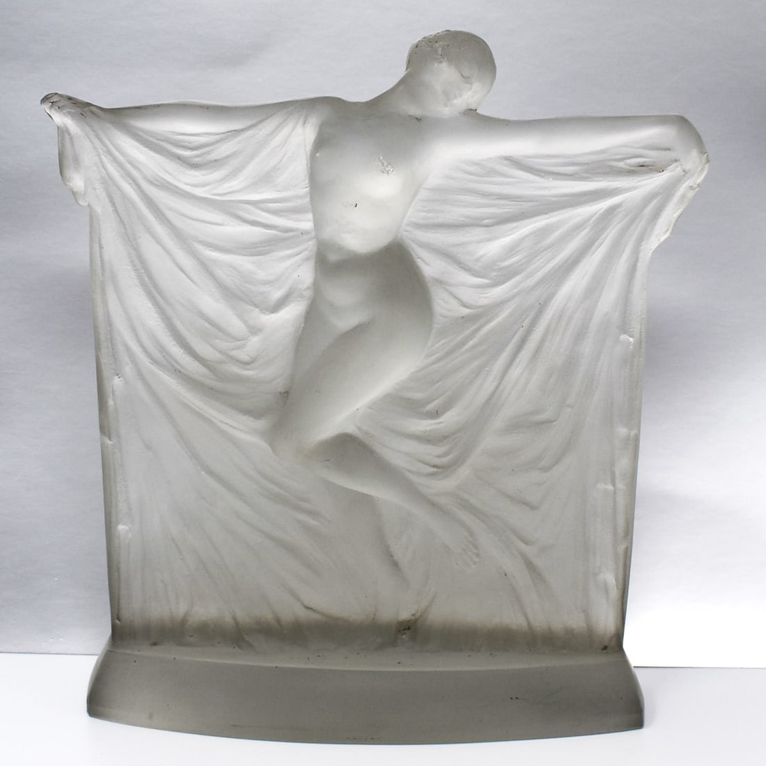 Rene Lalique, a "Suzanne" frosted glass statuette: A Rene Lalique model of "Suzanne" frosted glass figural sculpture, model introduced 1925, depicting a nude beauty draped in fabric. Signed " R. Lalique, France" on the underside. Approximate measureme
