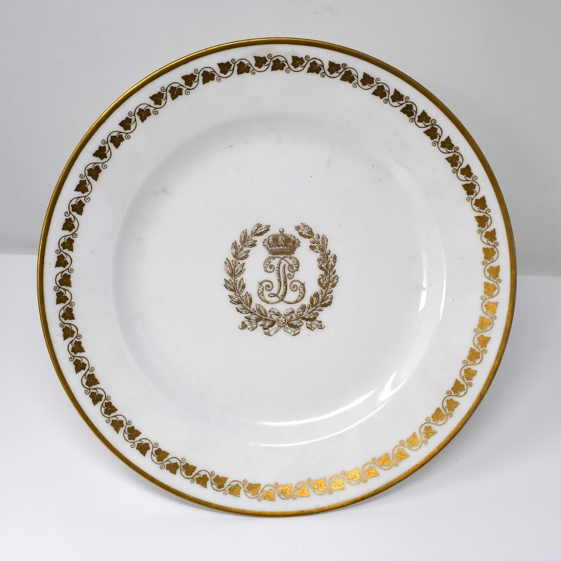 A SEVRES antique or vintage Louis Philippe pattern porcelain plate: An antique or vintage Sevres porcelain dinner plate with gilt decoration in the 'Louis Philippe' pattern. Approximate measurements: 9 1/2" in diameter or 24cm in diameter