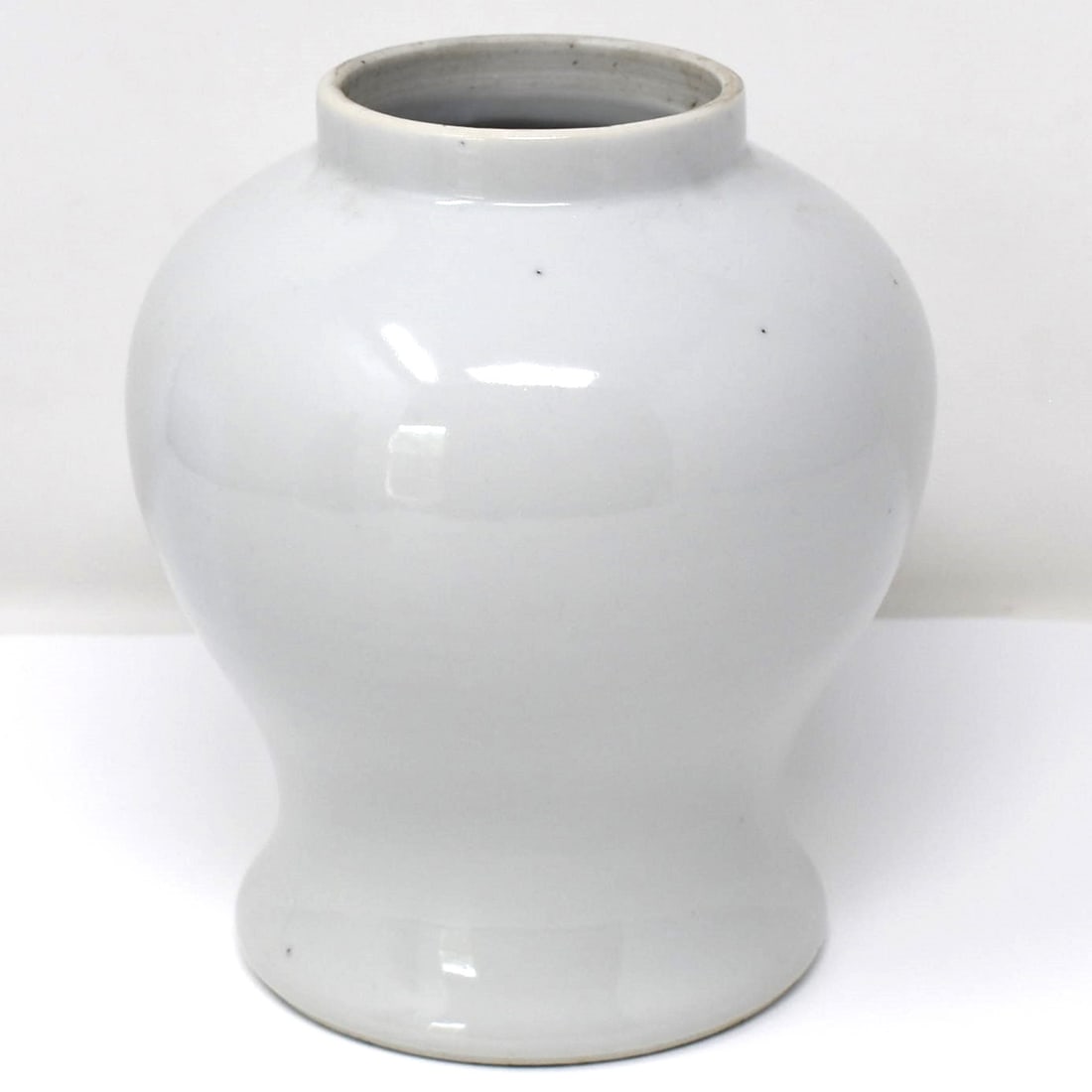 Chinese white glazed porcelain baluster vase: A Chinese white glazed porcelain baluster vase, with underglaze blue double circle marks. From the Maria Anglesio collection, thence by descent to the present owner. Approximate measurements: 6 1/2"H 
